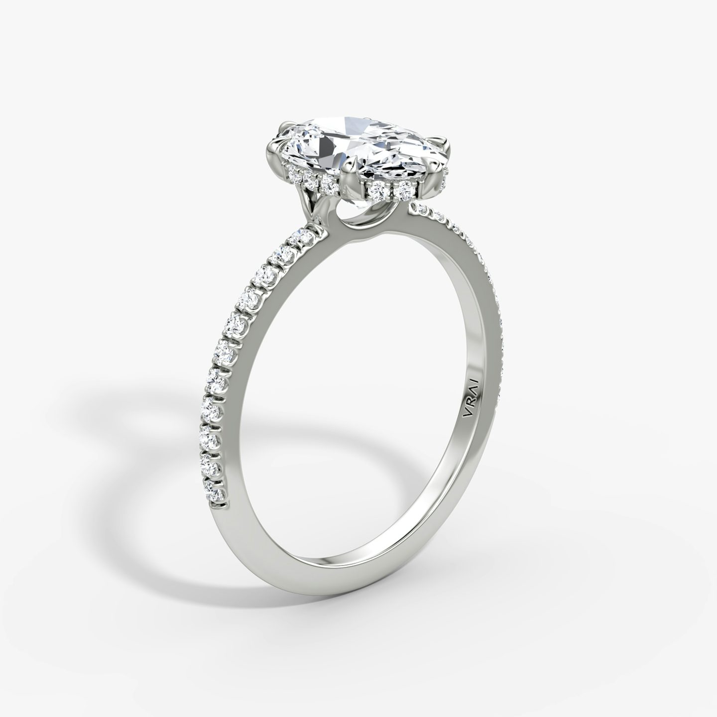 The Signature 6 Prong | Oval | Platinum | bandAccent: Pavé | bandWidth: standard | hiddenHalo: yes | diamondOrientation: vertical | caratWeight: other
