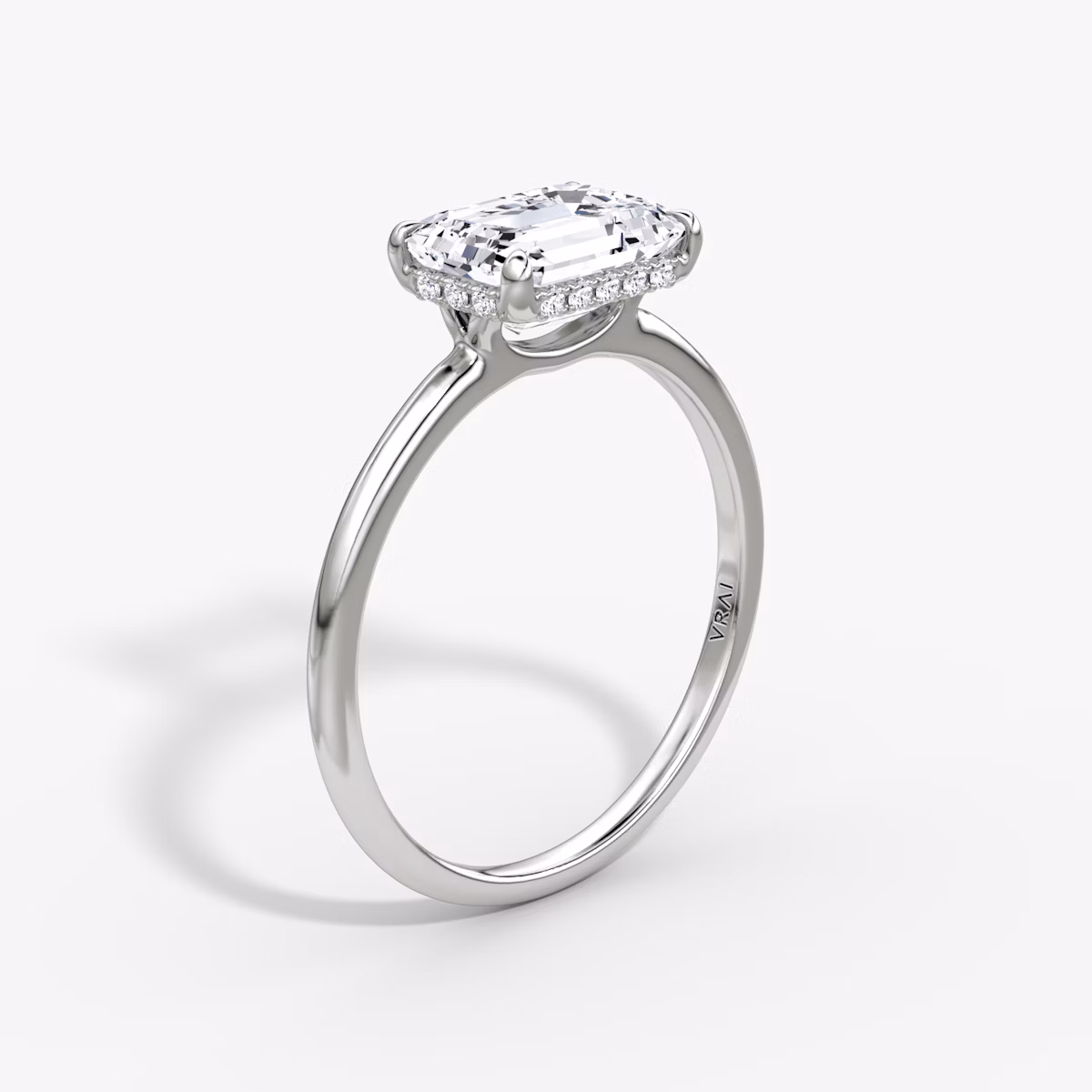 The Signature | Emerald | Platinum | bandAccent: Plain | bandWidth: standard | diamondOrientation: horizontal | hiddenHalo: yes | caratWeight: other