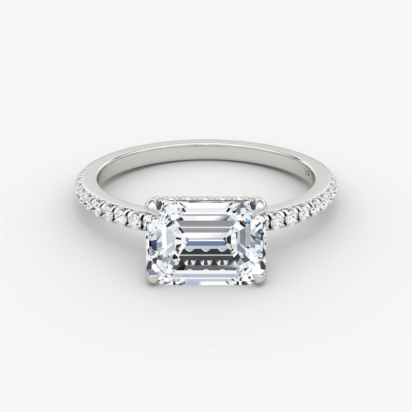 The Signature | Emerald | Platinum | bandAccent: Pavé | bandWidth: standard | diamondOrientation: horizontal | hiddenHalo: yes | caratWeight: other