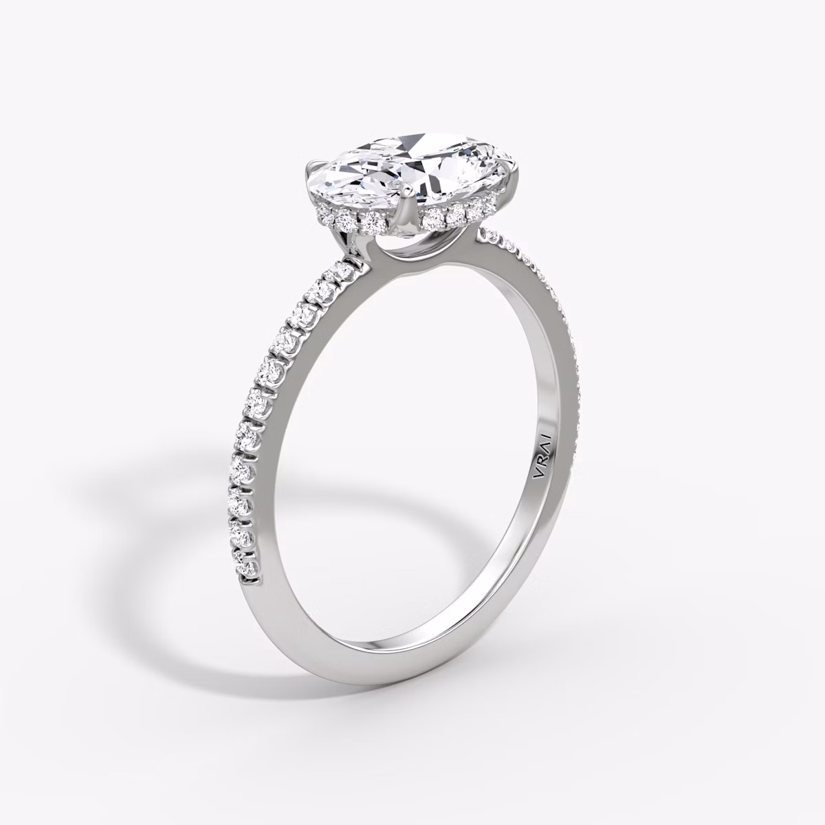 The Signature | Oval | Platinum | bandAccent: Pavé | bandWidth: standard | diamondOrientation: horizontal | hiddenHalo: yes | caratWeight: other