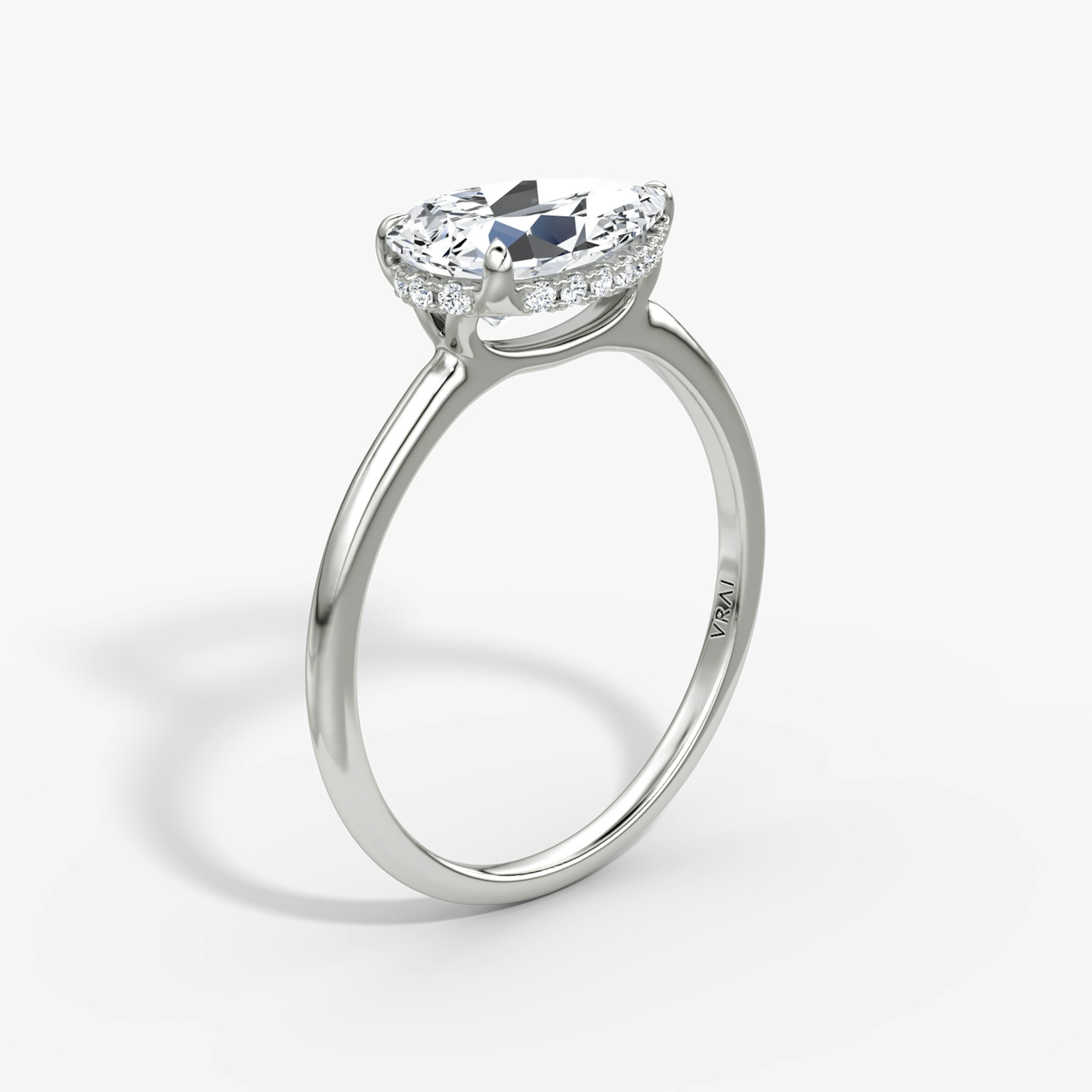 The Signature | Pear | Platinum | bandAccent: Plain | bandWidth: standard | diamondOrientation: horizontal | hiddenHalo: yes | caratWeight: other