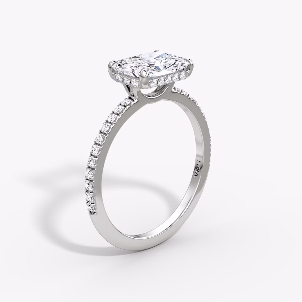The Signature | Radiant | Platinum | bandAccent: Pavé | bandWidth: standard | diamondOrientation: horizontal | hiddenHalo: yes | caratWeight: other