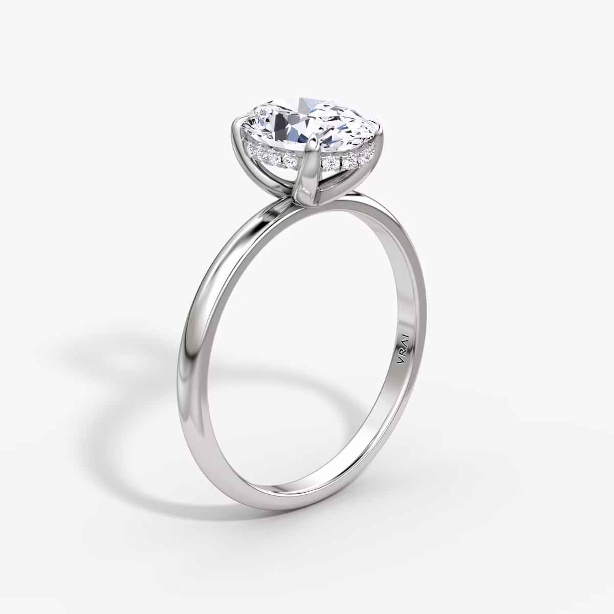 The Classic Hidden Halo | Oval | Platinum | bandAccent: Plain | bandWidth: large | prongStyle: Plain | diamondOrientation: vertical | caratWeight: other