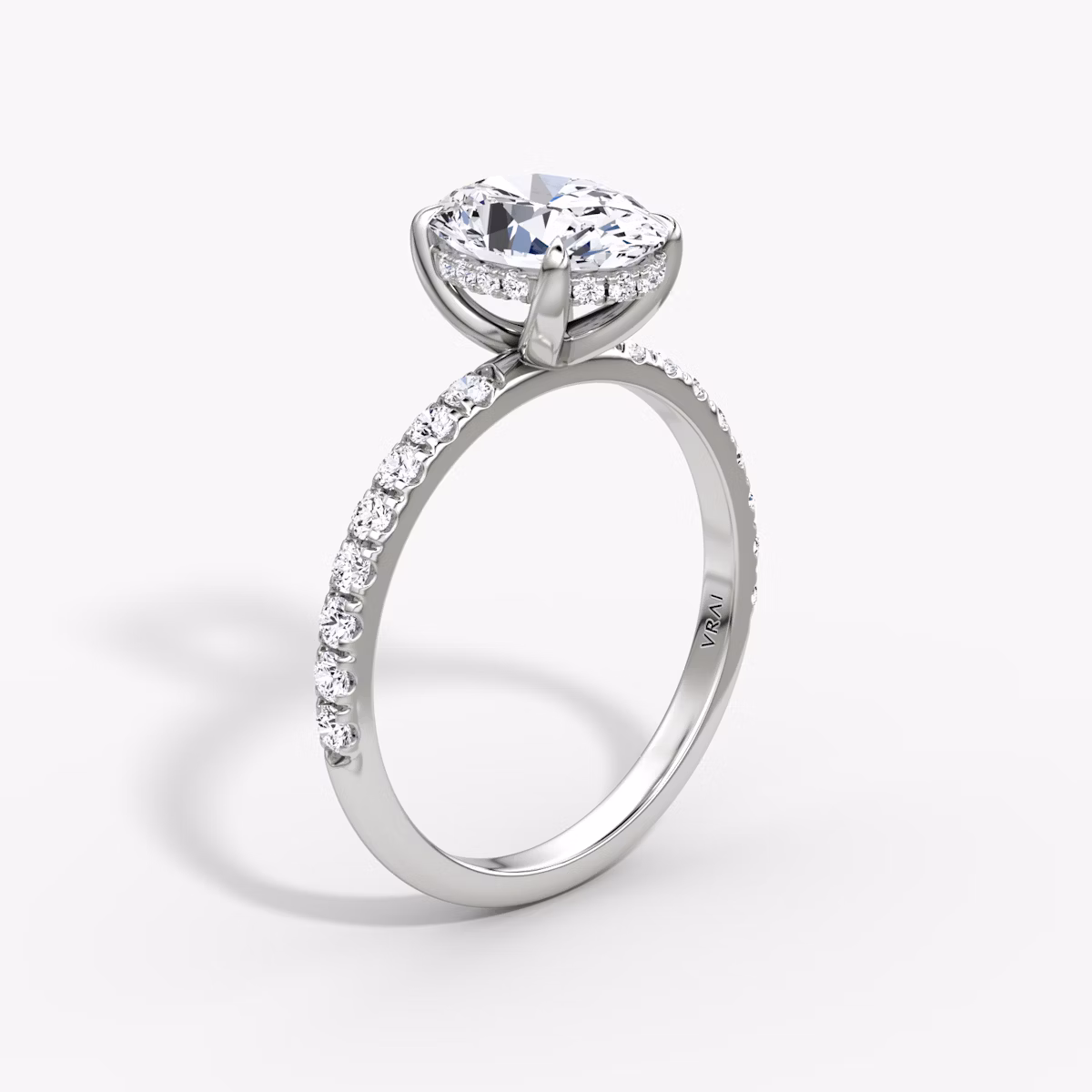 The Classic Hidden Halo | Oval | Platinum | bandAccent: Pavé | bandWidth: large | prongStyle: Plain | diamondOrientation: vertical | caratWeight: other