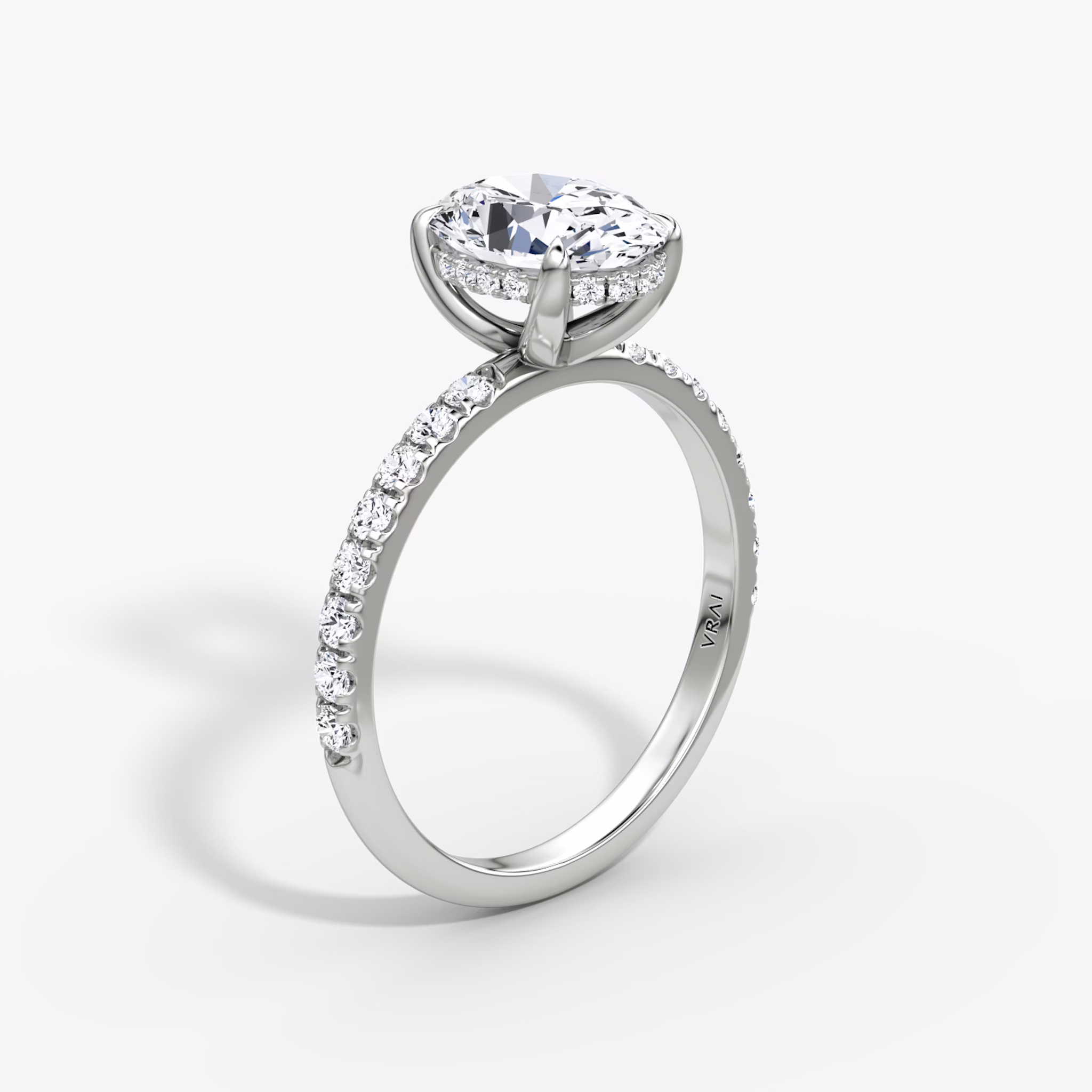 The Classic Hidden Halo | Oval | 18k | White Gold | bandAccent: Pavé | bandWidth: large | prongStyle: Plain | diamondOrientation: vertical | caratWeight: other