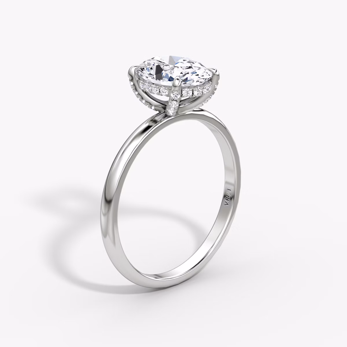 The Classic Hidden Halo | Oval | 18k | White Gold | bandAccent: Plain | bandWidth: large | prongStyle: Pavé | diamondOrientation: vertical | caratWeight: other