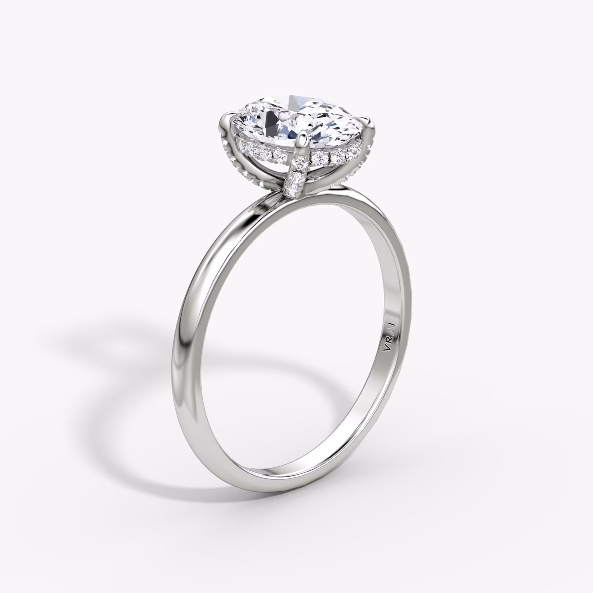 The Classic Hidden Halo | Oval | Platinum | bandAccent: Plain | bandWidth: large | prongStyle: Pavé | diamondOrientation: vertical | caratWeight: other