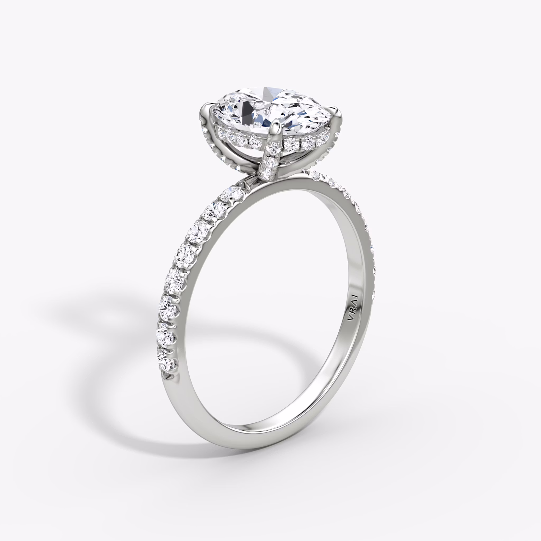 The Classic Hidden Halo | Oval | 18k | White Gold | bandAccent: Pavé | bandWidth: large | prongStyle: Pavé | diamondOrientation: vertical | caratWeight: other