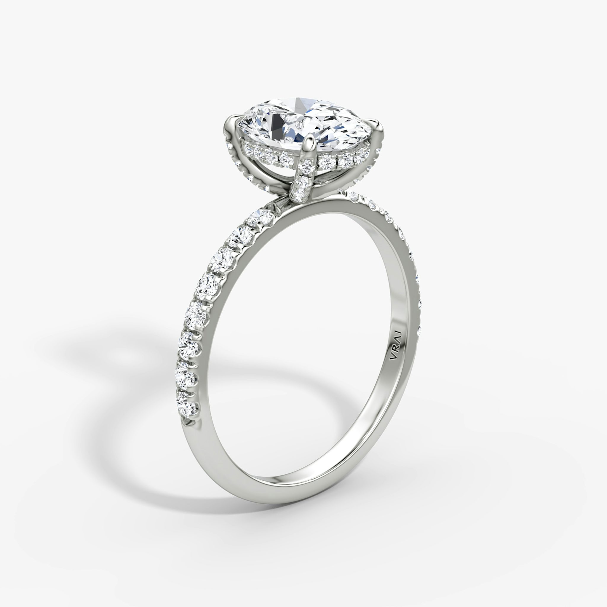 The Classic Hidden Halo | Oval | 18k | White Gold | bandAccent: Pavé | bandWidth: large | prongStyle: Pavé | diamondOrientation: vertical | caratWeight: other