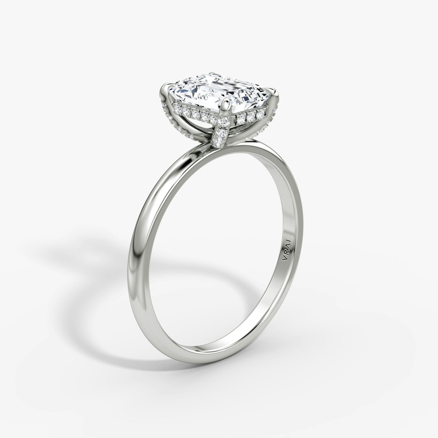 The Classic Hidden Halo | Emerald | 18k | White Gold | bandAccent: Plain | bandWidth: large | prongStyle: Pavé | diamondOrientation: vertical | caratWeight: other