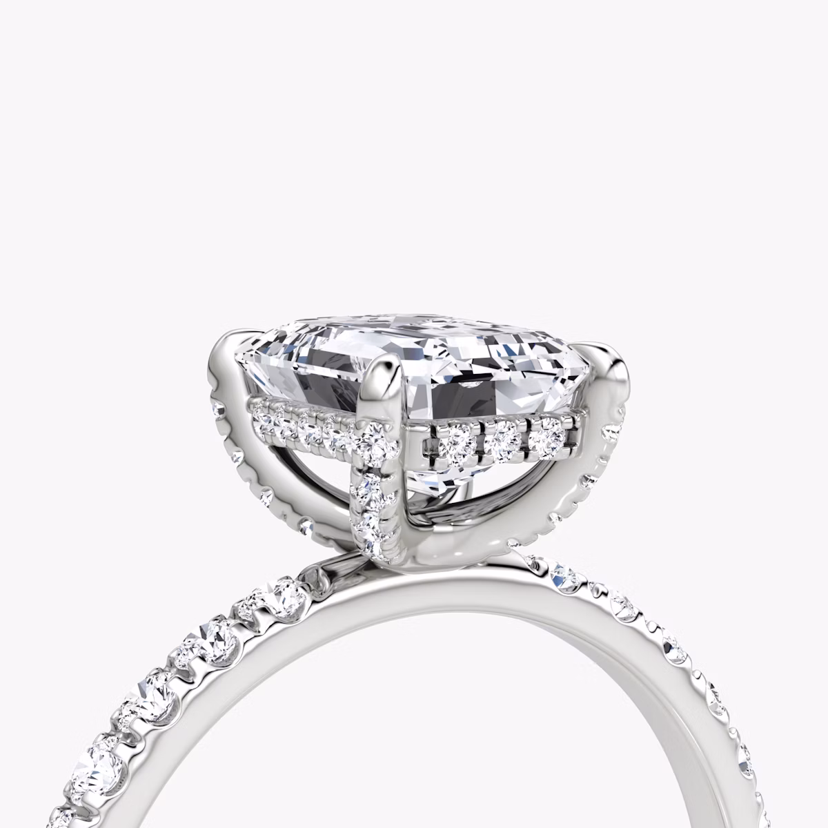 The Classic Hidden Halo | Emerald | Platinum | bandAccent: Pavé | bandWidth: large | prongStyle: Pavé | diamondOrientation: vertical | caratWeight: other