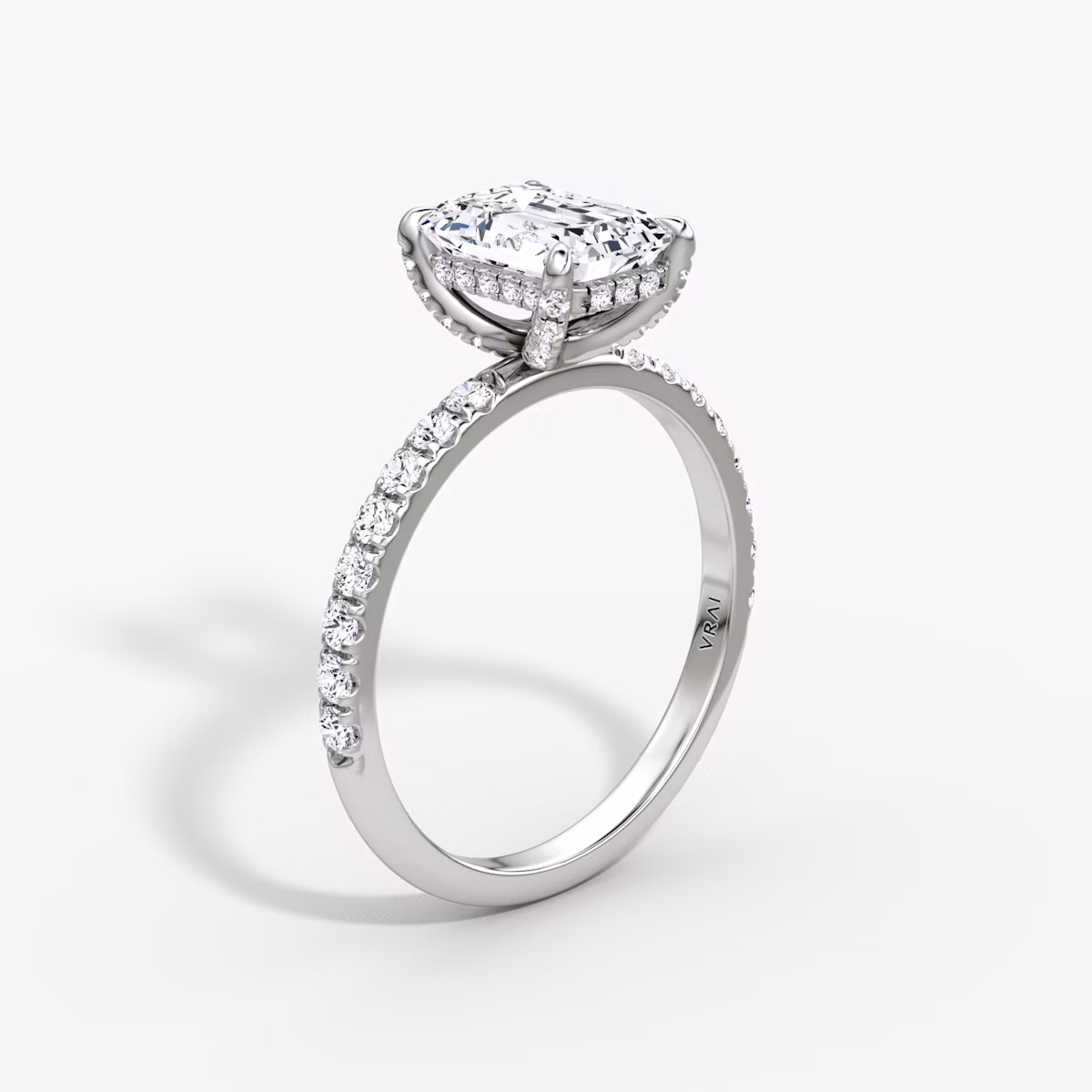The Classic Hidden Halo | Emerald | Platinum | bandAccent: Pavé | bandWidth: large | prongStyle: Pavé | diamondOrientation: vertical | caratWeight: other