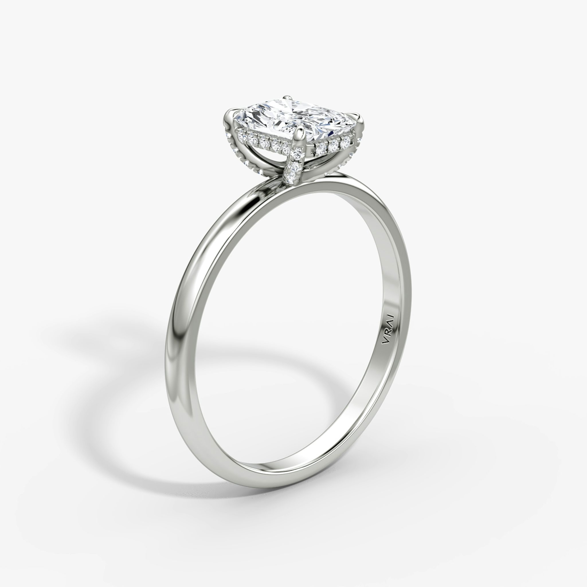 The Classic Hidden Halo | Radiant | 18k | White Gold | bandAccent: Plain | bandWidth: large | prongStyle: Pavé | diamondOrientation: vertical | caratWeight: other