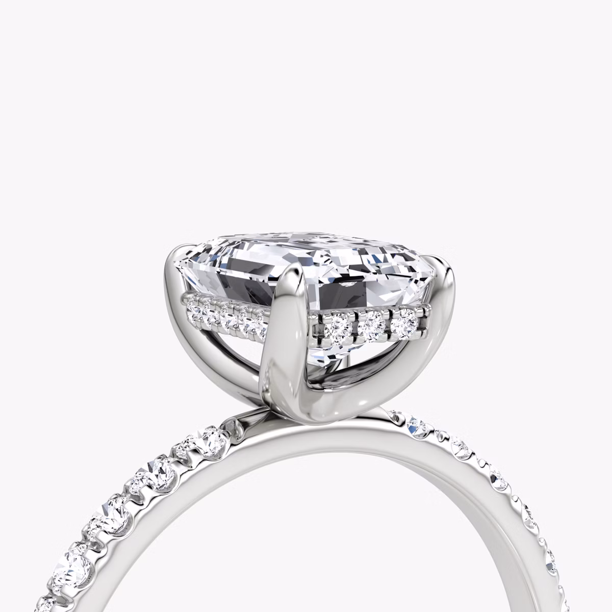 The Classic Hidden Halo | Emerald | Platinum | bandAccent: Pavé | bandWidth: large | prongStyle: Plain | diamondOrientation: vertical | caratWeight: other