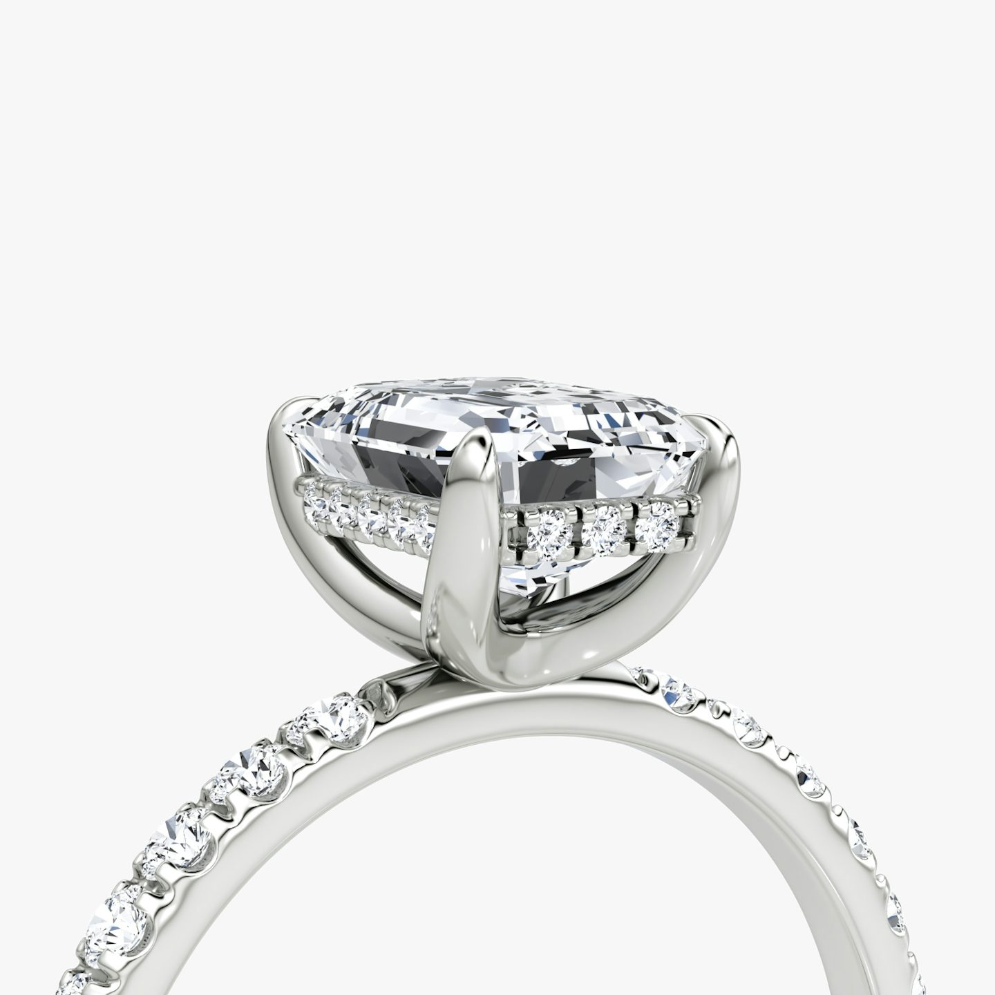 The Classic Hidden Halo | Emerald | Platinum | bandAccent: Pavé | bandWidth: large | prongStyle: Plain | diamondOrientation: vertical | caratWeight: other