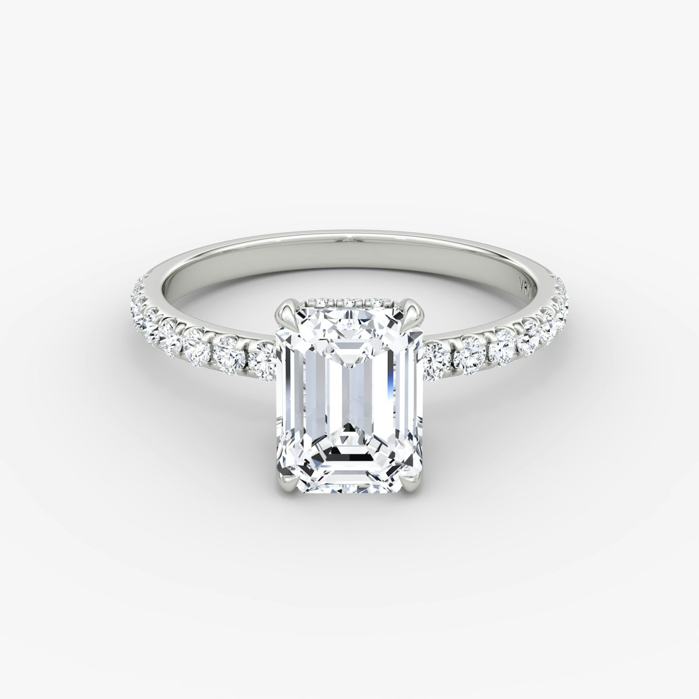 The Classic Hidden Halo | Emerald | Platinum | bandAccent: Pavé | bandWidth: large | prongStyle: Plain | diamondOrientation: vertical | caratWeight: other