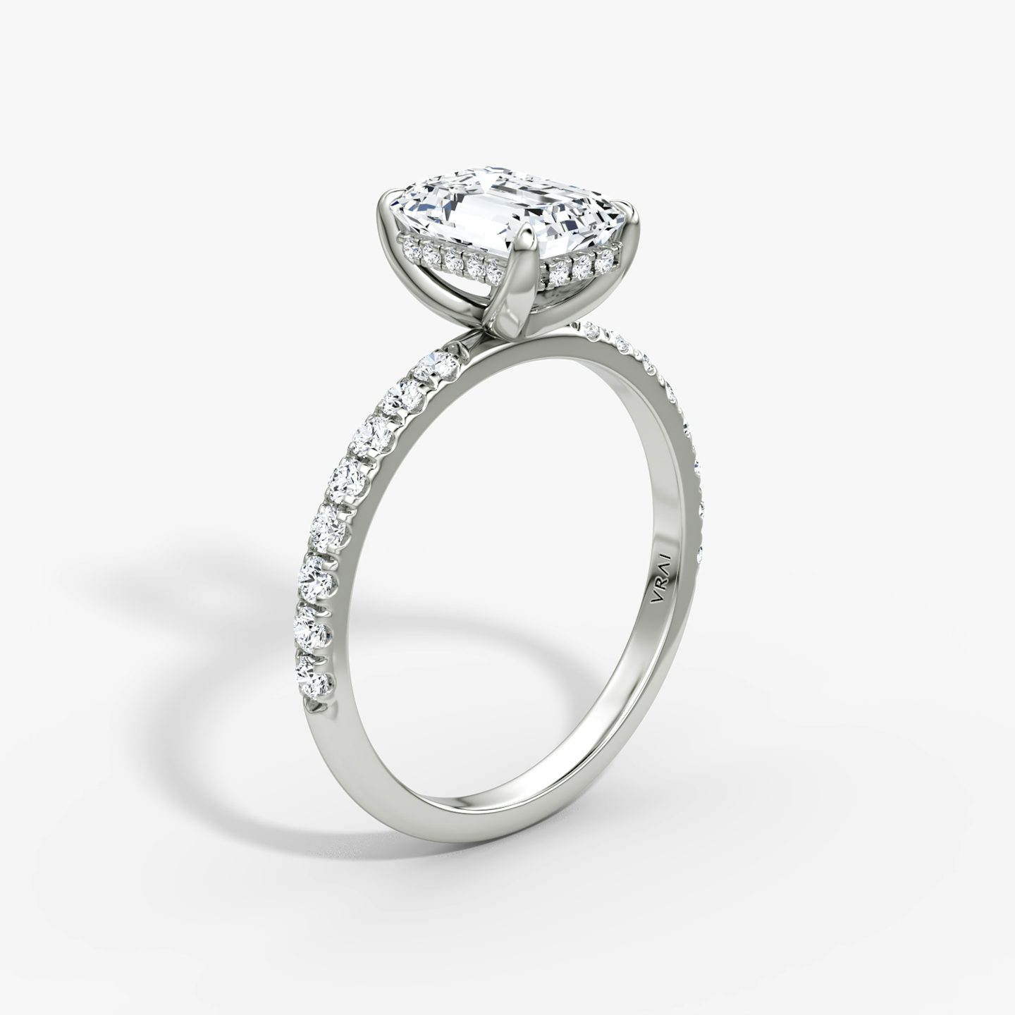 The Classic Hidden Halo | Emerald | Platinum | bandAccent: Pavé | bandWidth: large | prongStyle: Plain | diamondOrientation: vertical | caratWeight: other
