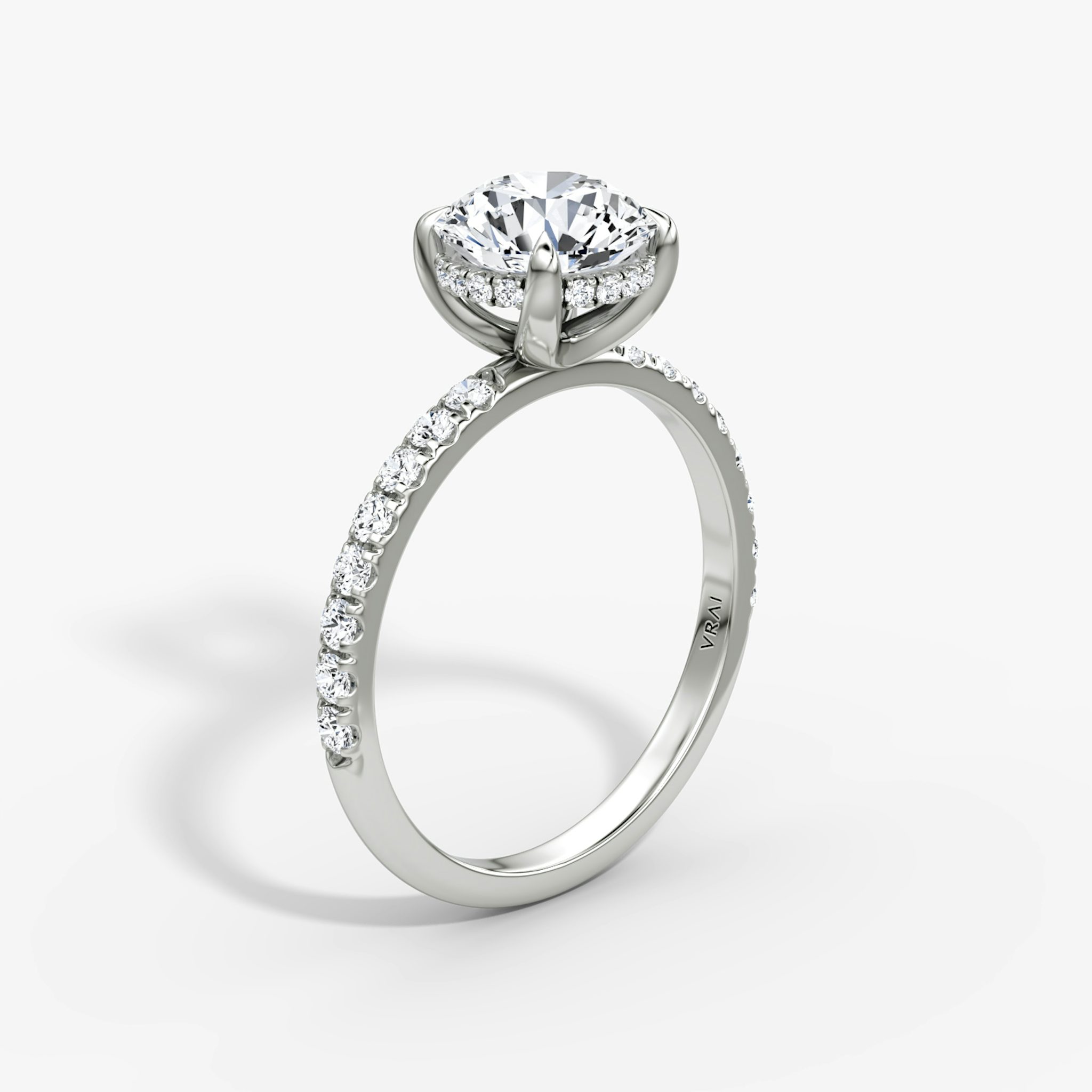 The Classic Hidden Halo | Round Brilliant | Platinum | bandAccent: Pavé | bandWidth: large | caratWeight: 1.0ct | prongStyle: Plain | diamondOrientation: vertical