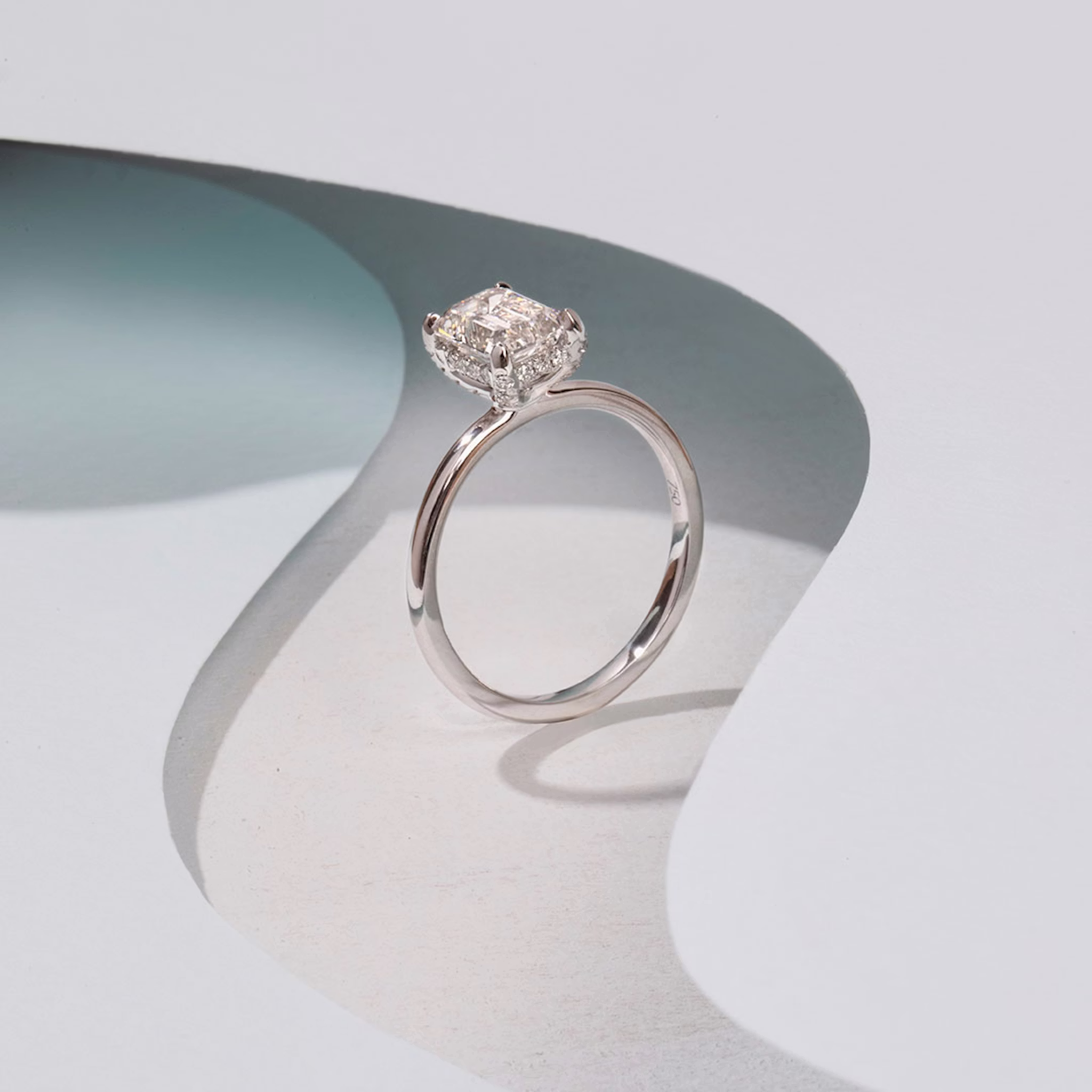 The Classic Hidden Halo | Emerald | Platinum | bandAccent: Plain | bandWidth: large | prongStyle: Pavé | diamondOrientation: vertical | caratWeight: other