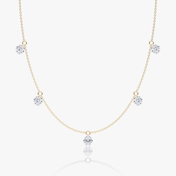 A Floating Station Necklace in white gold.