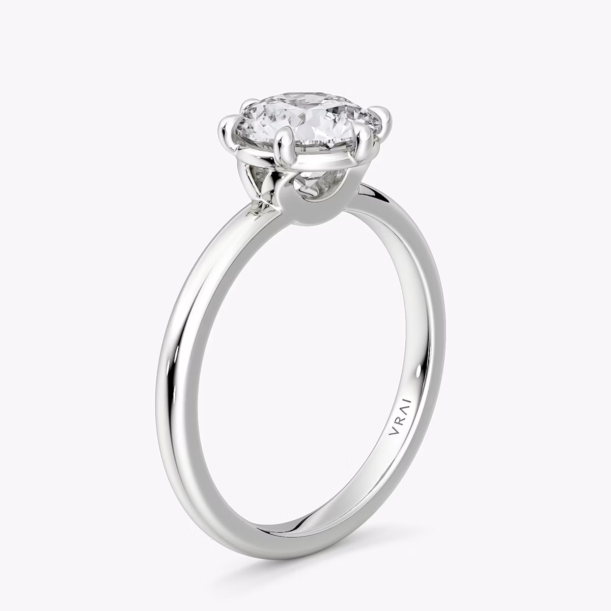 The Signature 6 Prong | Round Brilliant | 18k | White Gold | bandAccent: Plain | bandWidth: large | caratWeight: 1.0ct | hiddenHalo: no | diamondOrientation: vertical