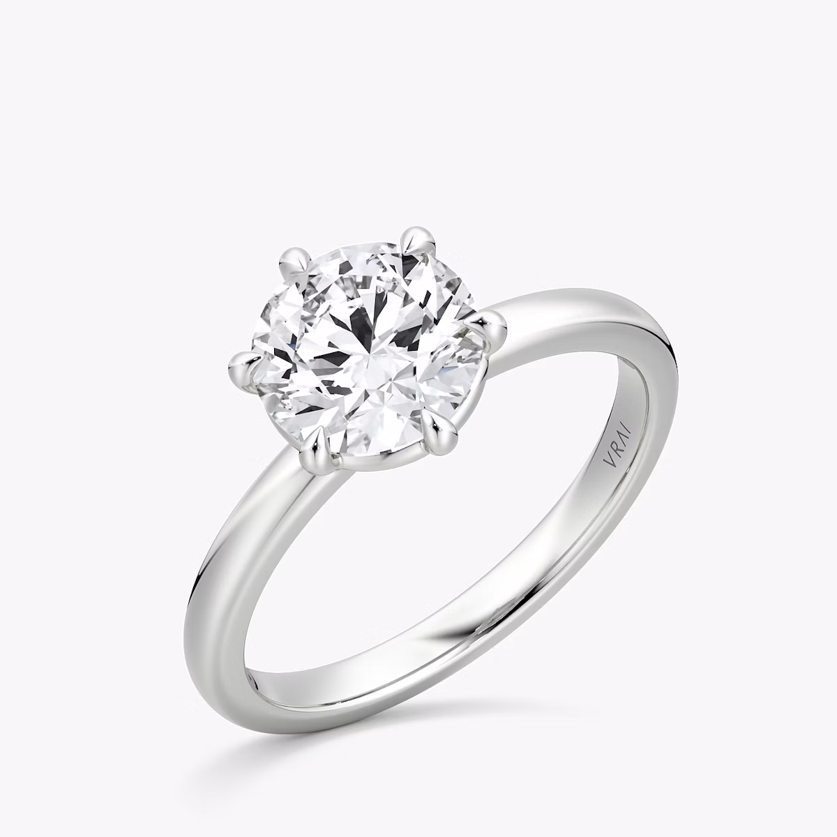 The Signature 6 Prong | Round Brilliant | 18k | White Gold | bandAccent: Plain | bandWidth: large | caratWeight: 1.0ct | hiddenHalo: no | diamondOrientation: vertical