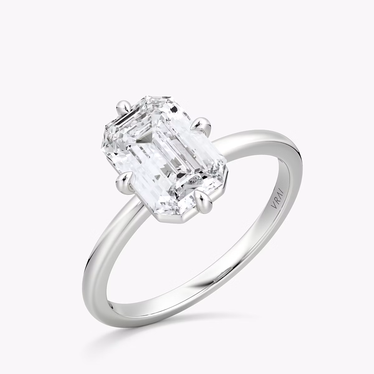 The Compass Solitaire | Emerald | Platinum | bandAccent: Plain | diamondOrientation: vertical | caratWeight: other