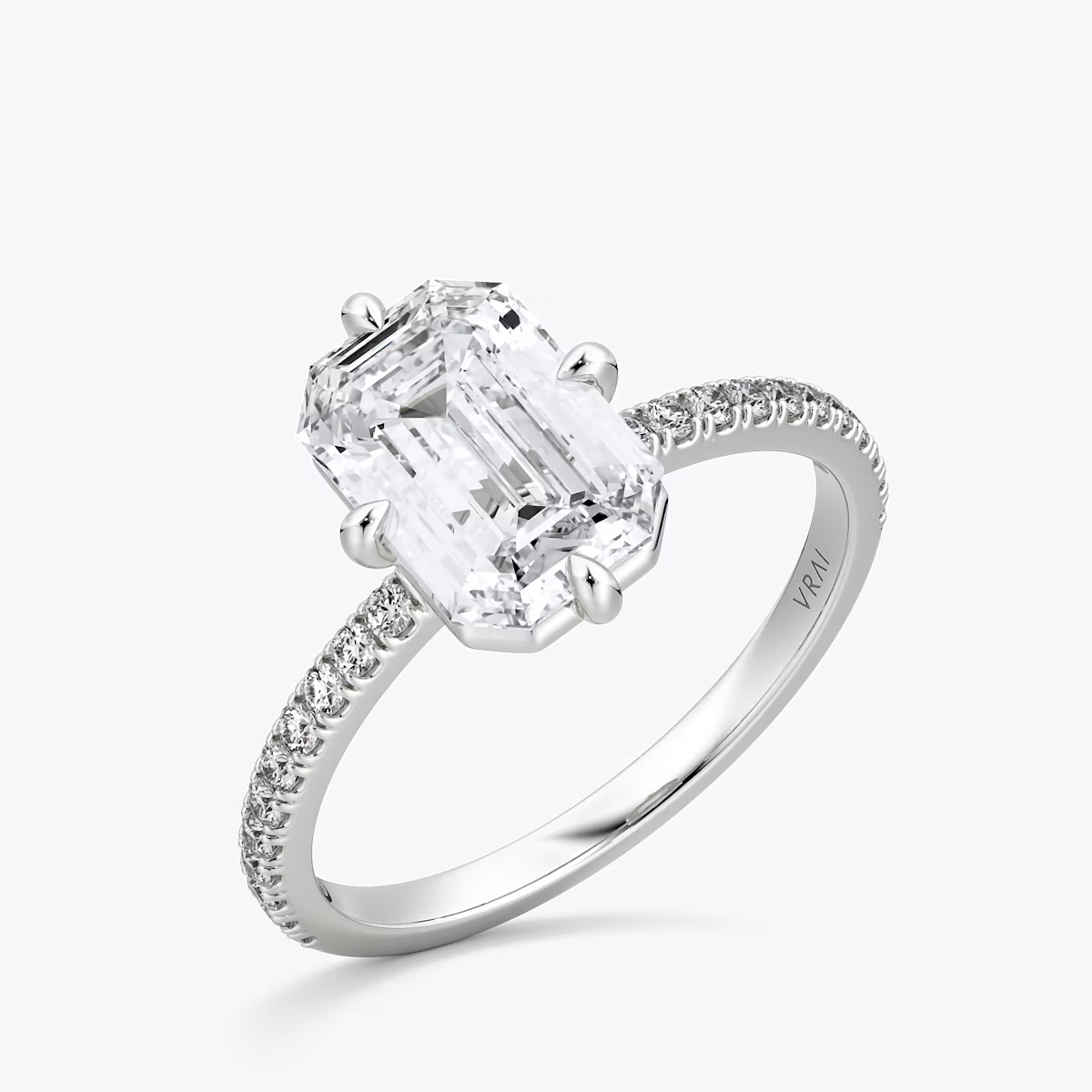 The Compass Solitaire | Emerald | Platinum | bandAccent: Pavé | diamondOrientation: vertical | caratWeight: other
