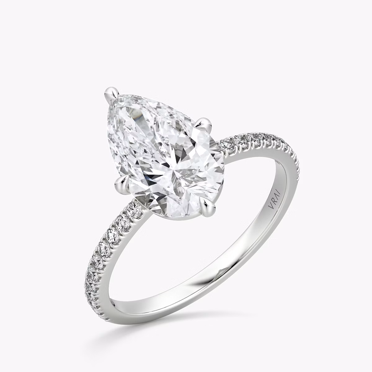 The Compass Solitaire | Pear | 18k | White Gold | bandAccent: Pavé | diamondOrientation: vertical | caratWeight: other