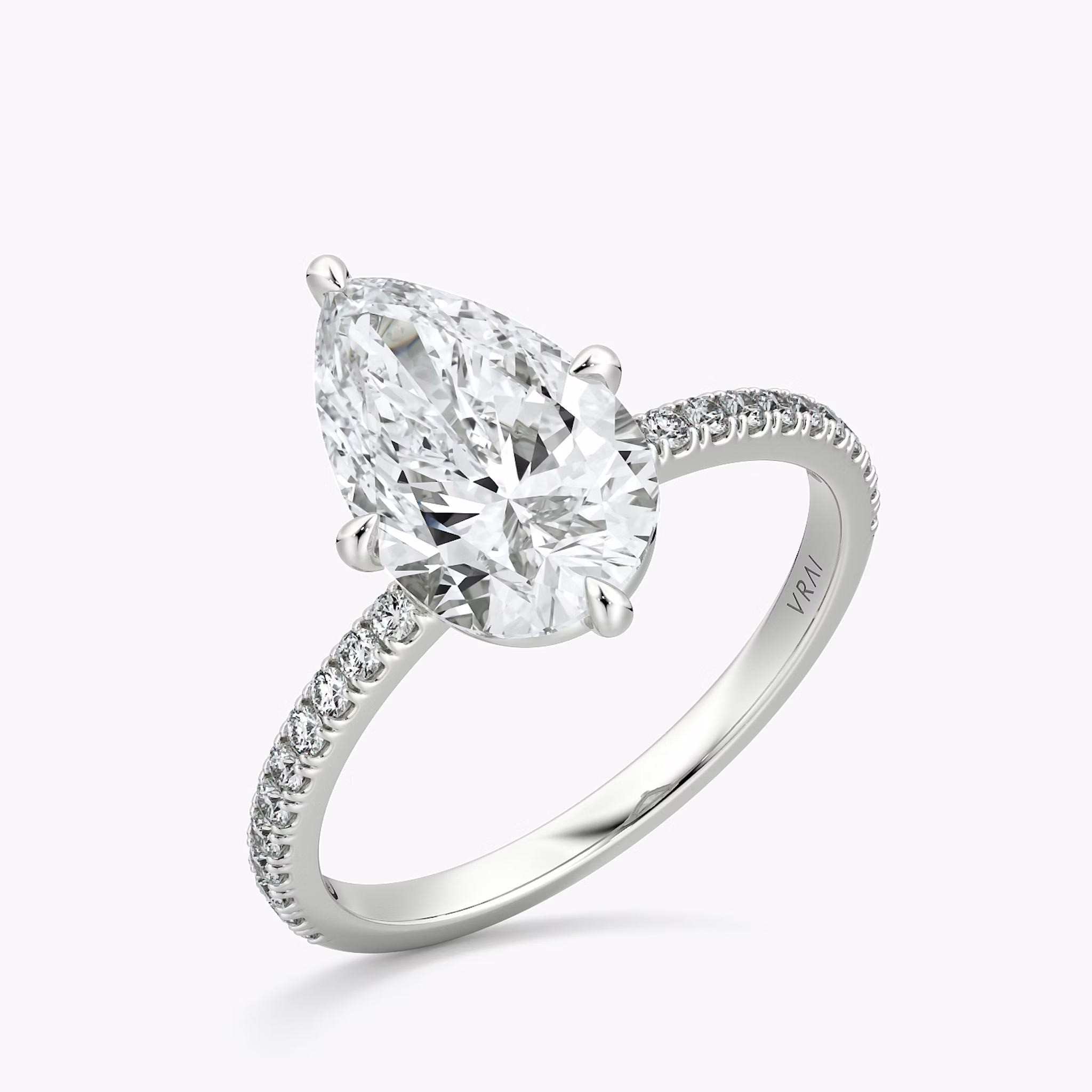 The Compass Solitaire | Pear | 18k | White Gold | bandAccent: Pavé | diamondOrientation: vertical | caratWeight: other