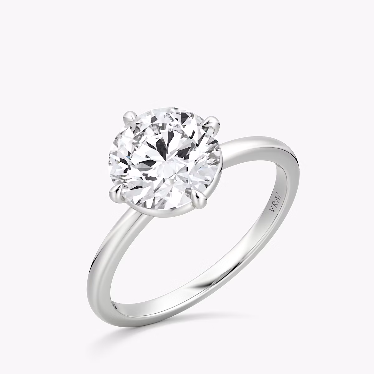 The Compass Solitaire | Round Brilliant | 18k | White Gold | bandAccent: Plain | caratWeight: 1.5ct | diamondOrientation: vertical