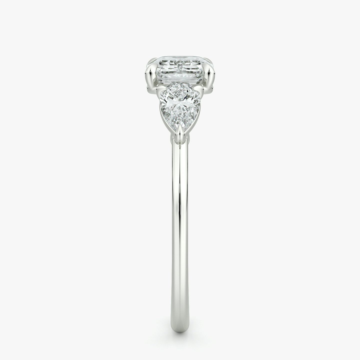 The Three Stone | Emerald | 18k | White Gold | bandAccent: Plain | diamondOrientation: horizontal | sideStoneCarat: 0.25ct | sideStoneShape: Pear | caratWeight: other