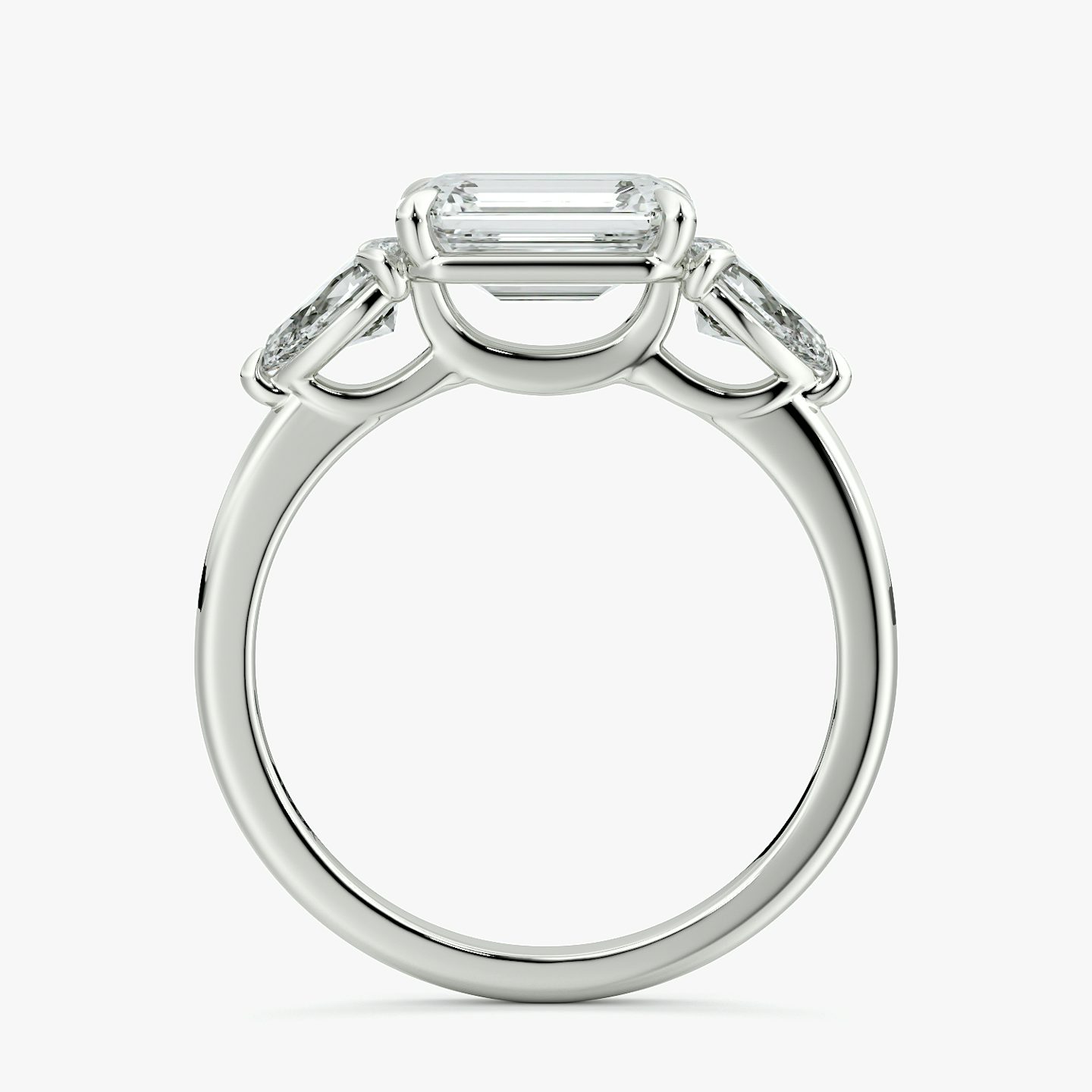 The Three Stone | Emerald | 18k | White Gold | bandAccent: Plain | diamondOrientation: horizontal | sideStoneCarat: 0.25ct | sideStoneShape: Pear | caratWeight: other