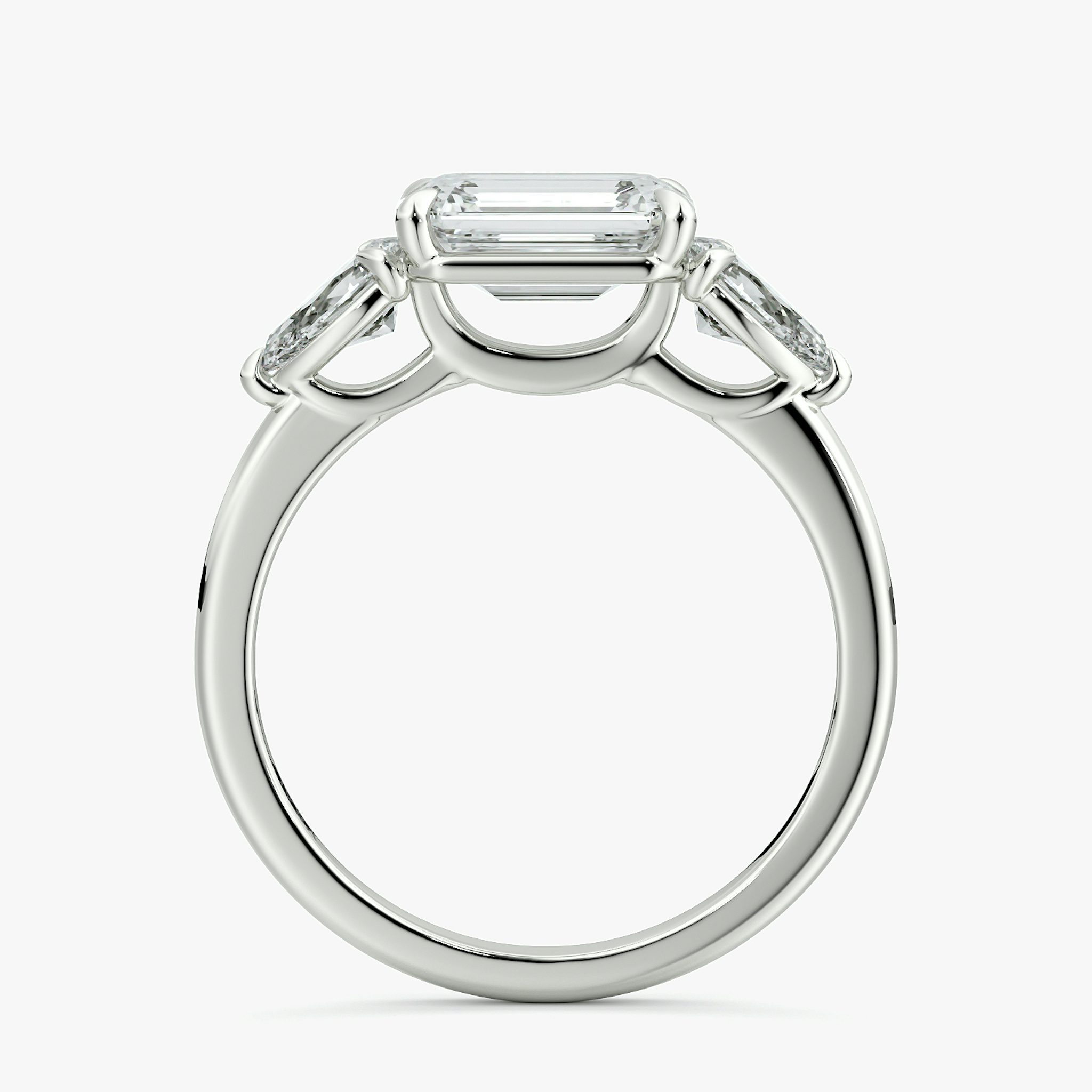 The Three Stone | Emerald | 18k | White Gold | bandAccent: Plain | diamondOrientation: horizontal | sideStoneCarat: 0.25ct | sideStoneShape: Pear | caratWeight: other