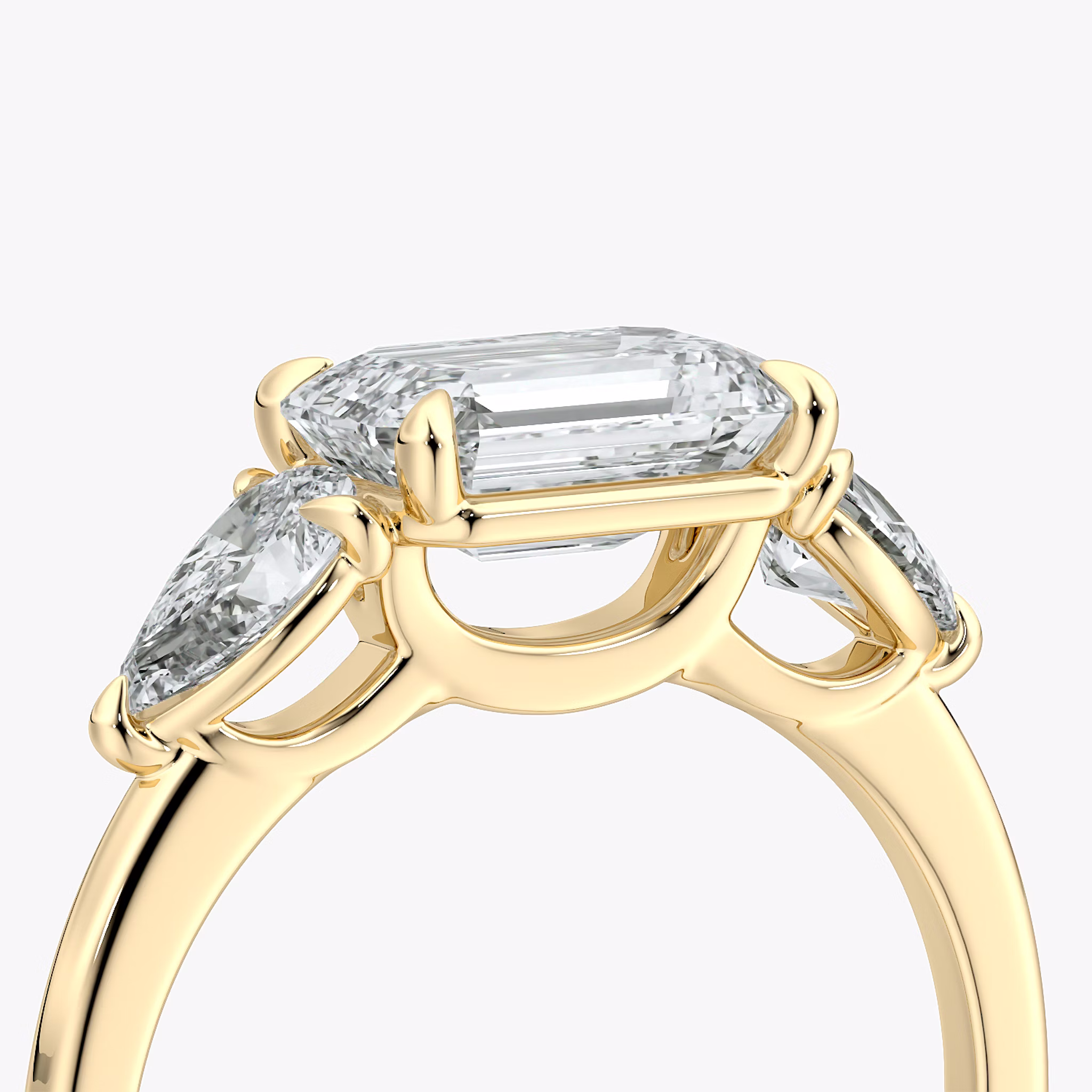 The Three Stone | Emerald | 18k | Yellow Gold | bandAccent: Plain | diamondOrientation: horizontal | sideStoneCarat: 0.25ct | sideStoneShape: Pear | caratWeight: other