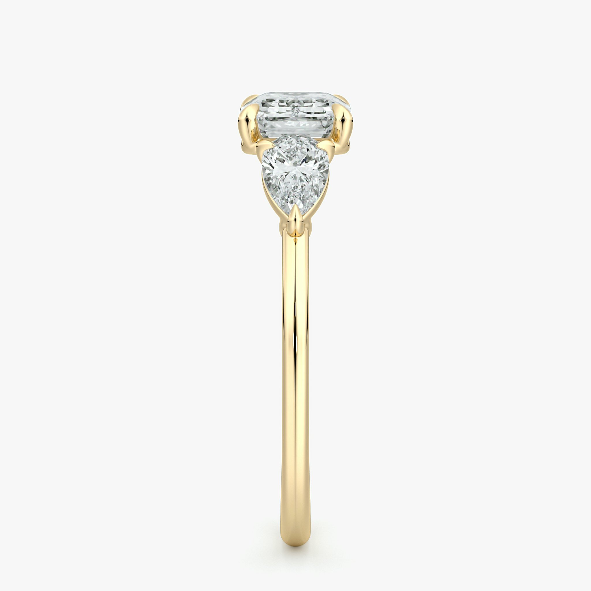 The Three Stone | Emerald | 18k | Yellow Gold | bandAccent: Plain | diamondOrientation: horizontal | sideStoneCarat: 0.25ct | sideStoneShape: Pear | caratWeight: other
