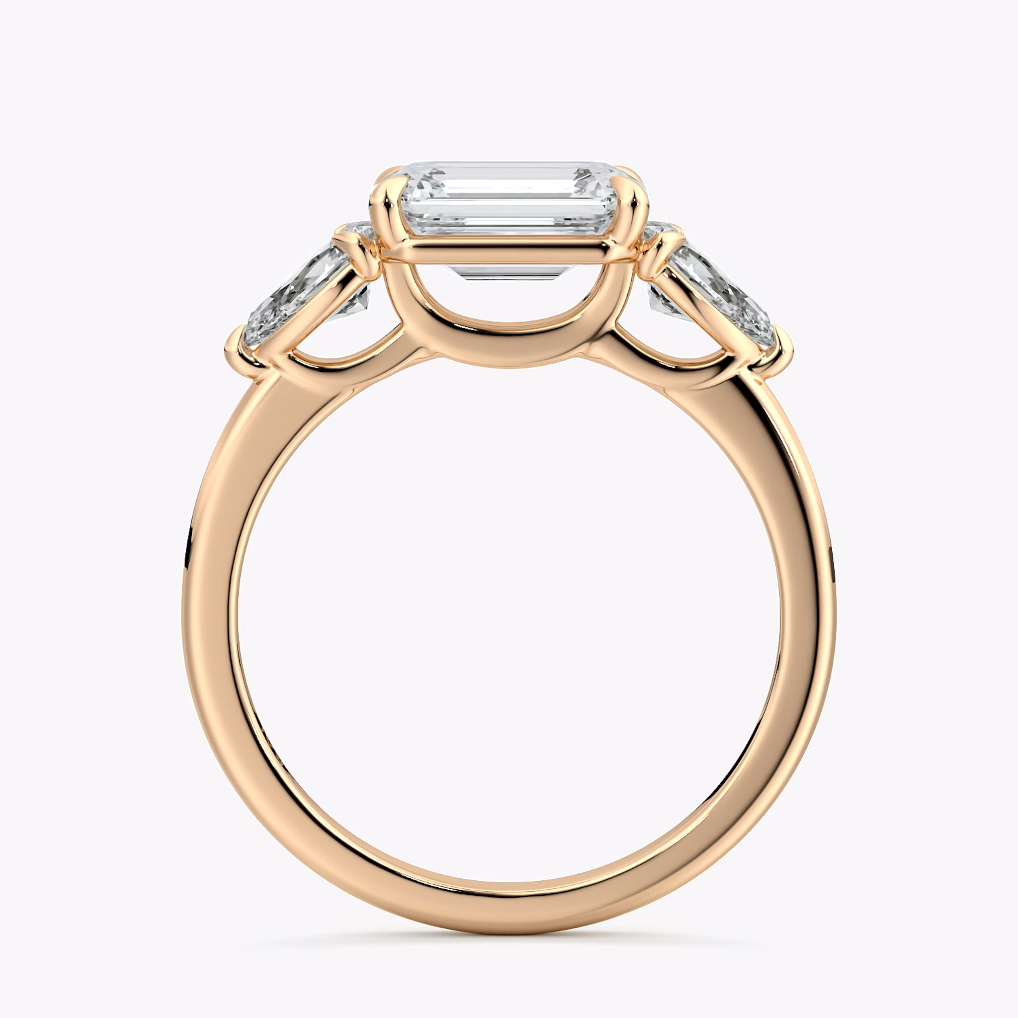 The Three Stone | Emerald | 14k | Rose Gold | bandAccent: Plain | diamondOrientation: horizontal | sideStoneCarat: 0.25ct | sideStoneShape: Pear | caratWeight: other
