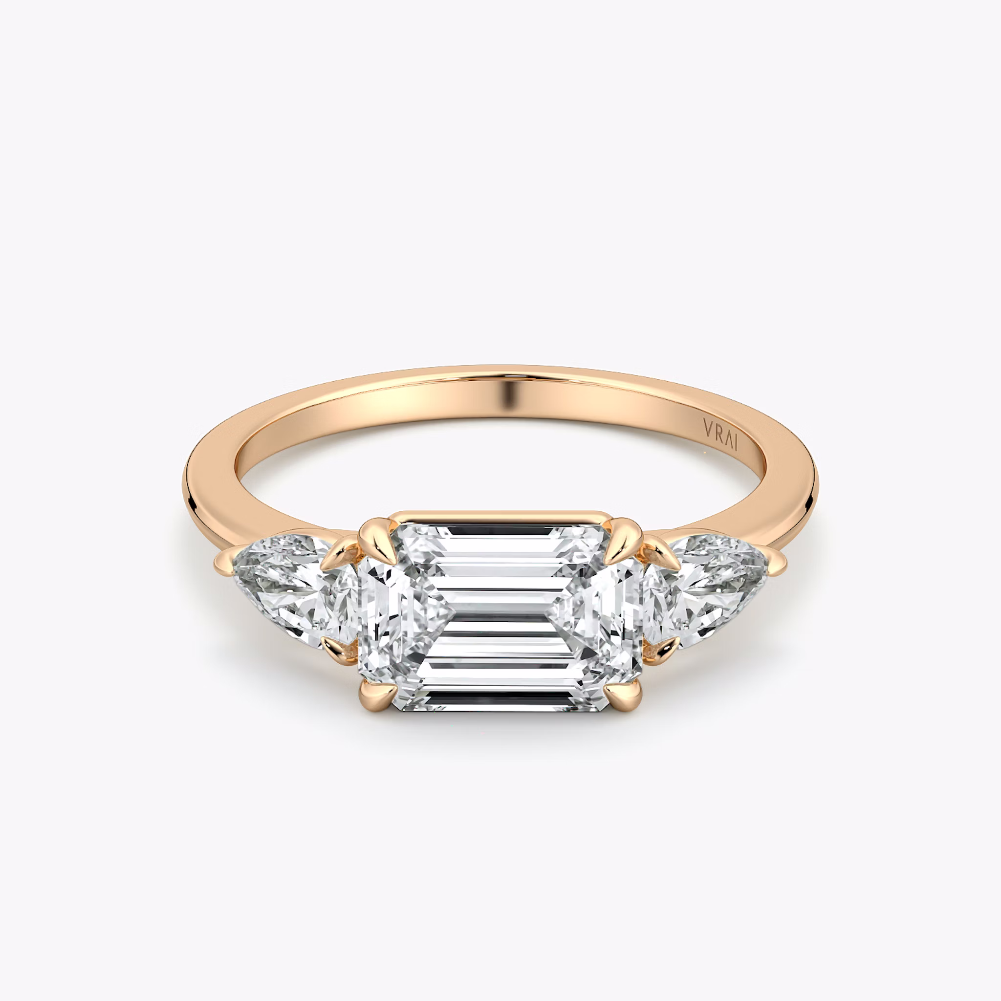 The Three Stone | Emerald | 14k | Rose Gold | bandAccent: Plain | diamondOrientation: horizontal | sideStoneCarat: 0.25ct | sideStoneShape: Pear | caratWeight: other