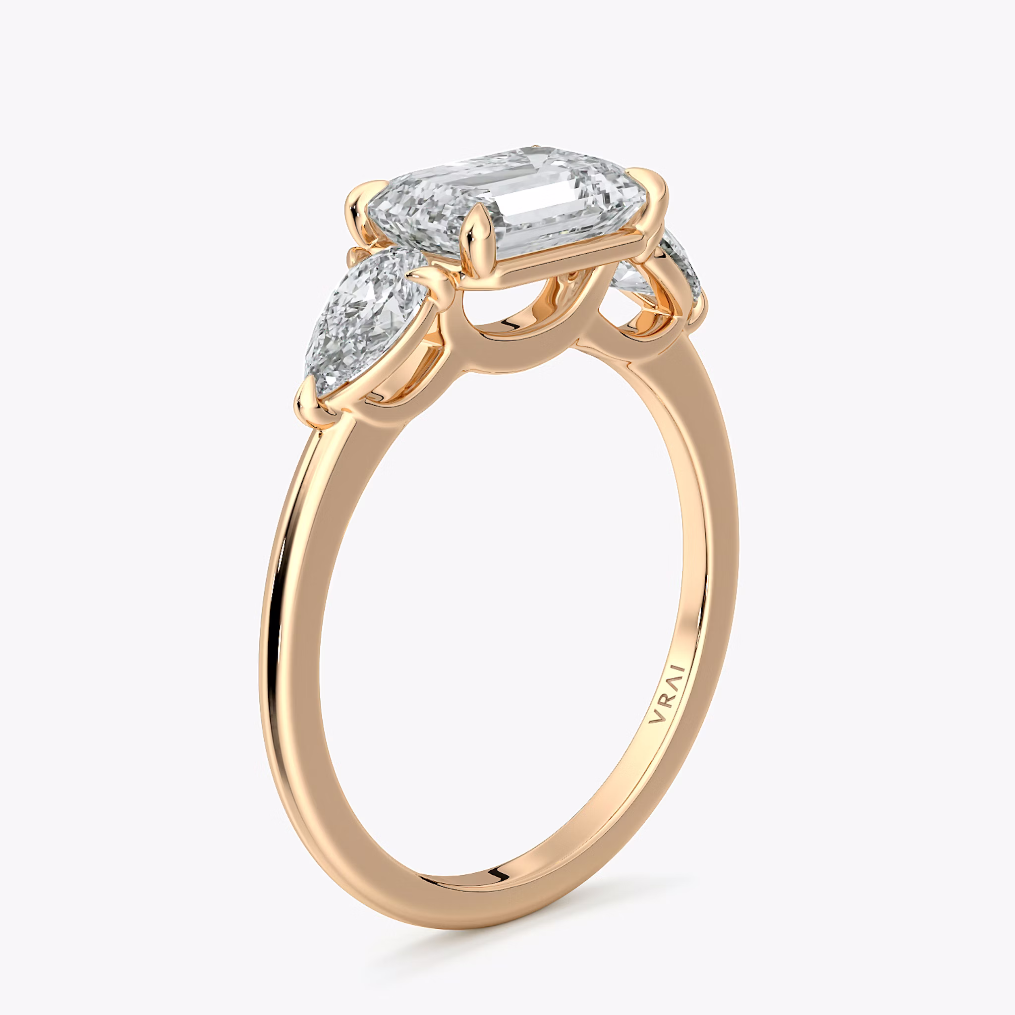 The Three Stone | Emerald | 14k | Rose Gold | bandAccent: Plain | diamondOrientation: horizontal | sideStoneCarat: 0.25ct | sideStoneShape: Pear | caratWeight: other