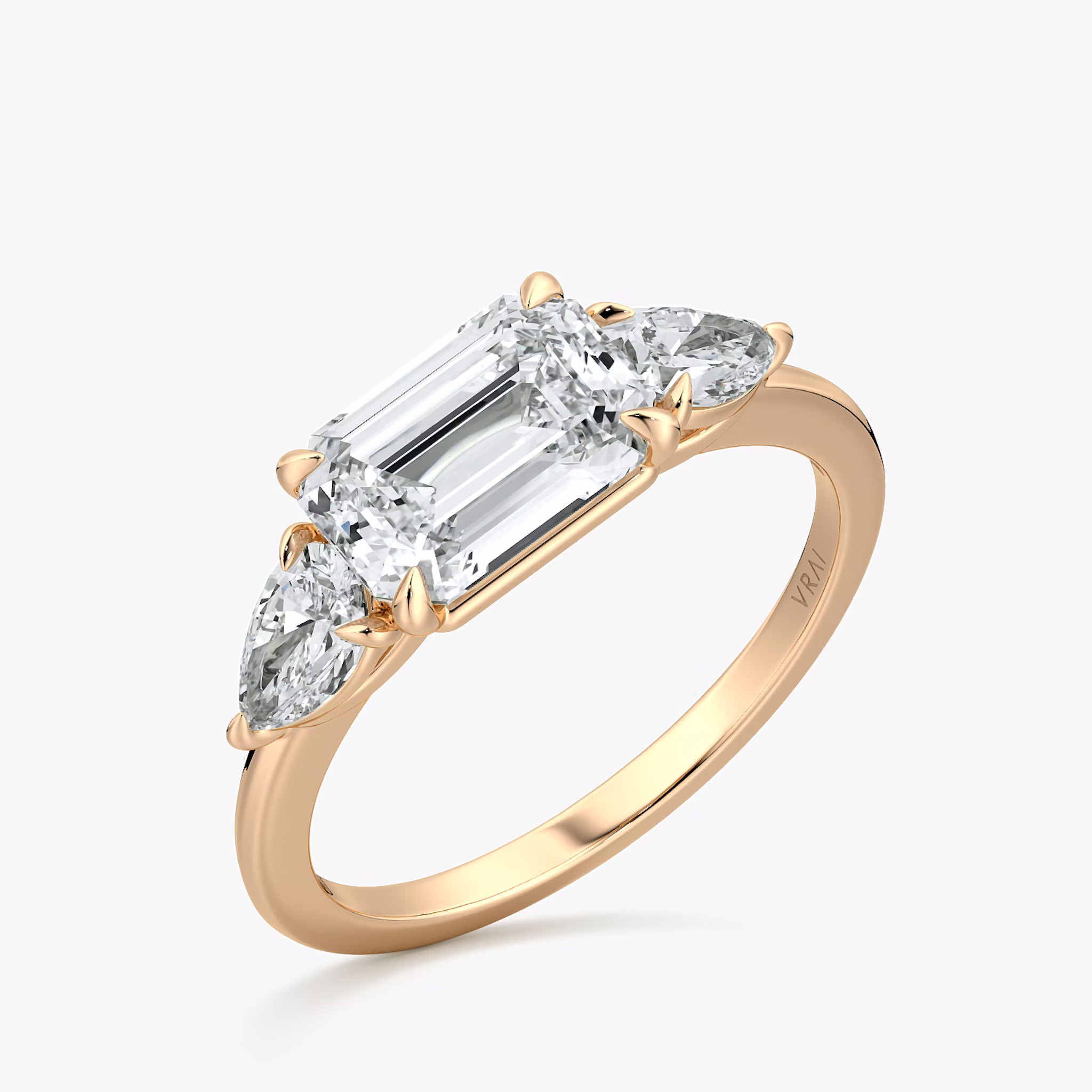 The Three Stone | Emerald | 14k | Rose Gold | bandAccent: Plain | diamondOrientation: horizontal | sideStoneCarat: 0.25ct | sideStoneShape: Pear | caratWeight: other