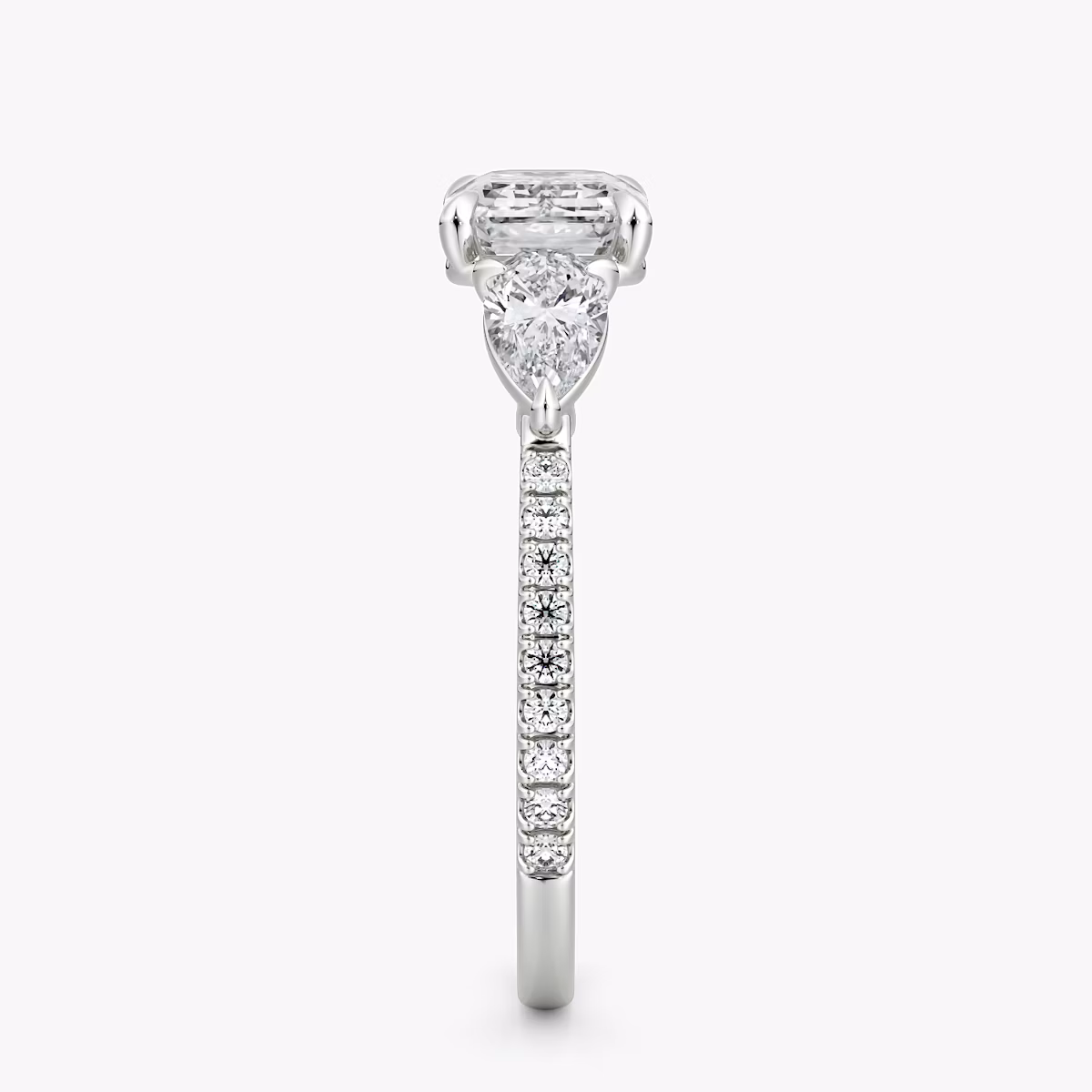 The Three Stone | Emerald | 18k | White Gold | bandAccent: Pavé | diamondOrientation: horizontal | sideStoneCarat: 0.25ct | sideStoneShape: Pear | caratWeight: other