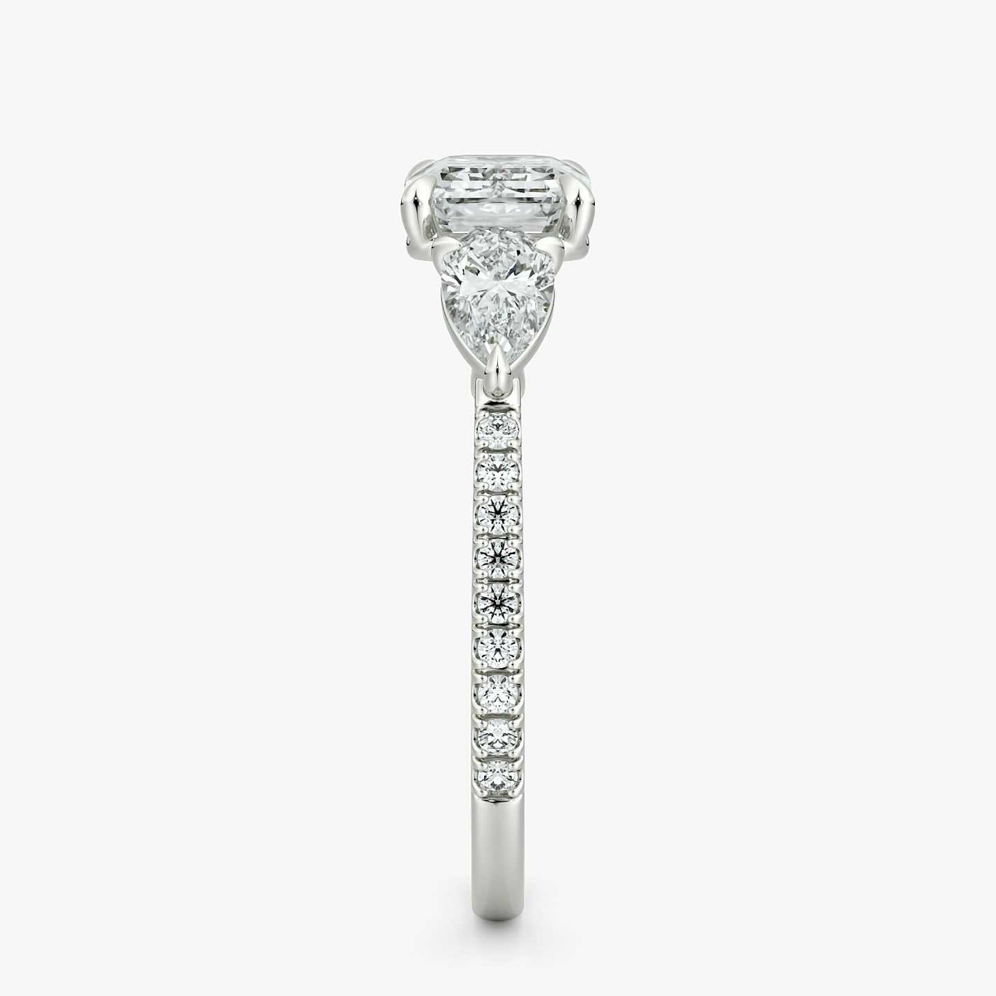 The Three Stone | Emerald | Platinum | bandAccent: Pavé | diamondOrientation: horizontal | sideStoneCarat: 0.25ct | sideStoneShape: Pear | caratWeight: other