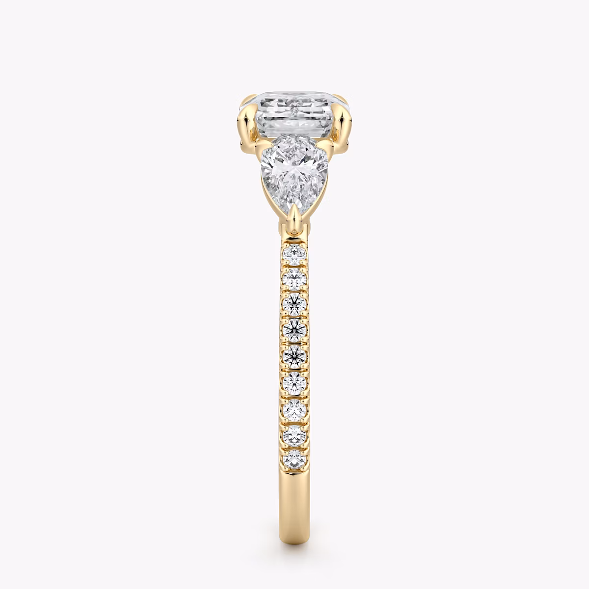 The Three Stone | Emerald | 18k | Yellow Gold | bandAccent: Pavé | diamondOrientation: horizontal | sideStoneCarat: 0.25ct | sideStoneShape: Pear | caratWeight: other