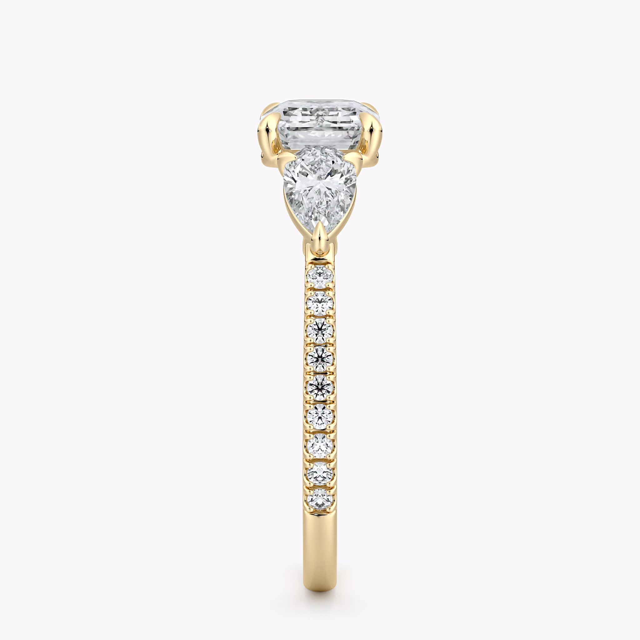The Three Stone | Emerald | 18k | Yellow Gold | bandAccent: Pavé | diamondOrientation: horizontal | sideStoneCarat: 0.25ct | sideStoneShape: Pear | caratWeight: other