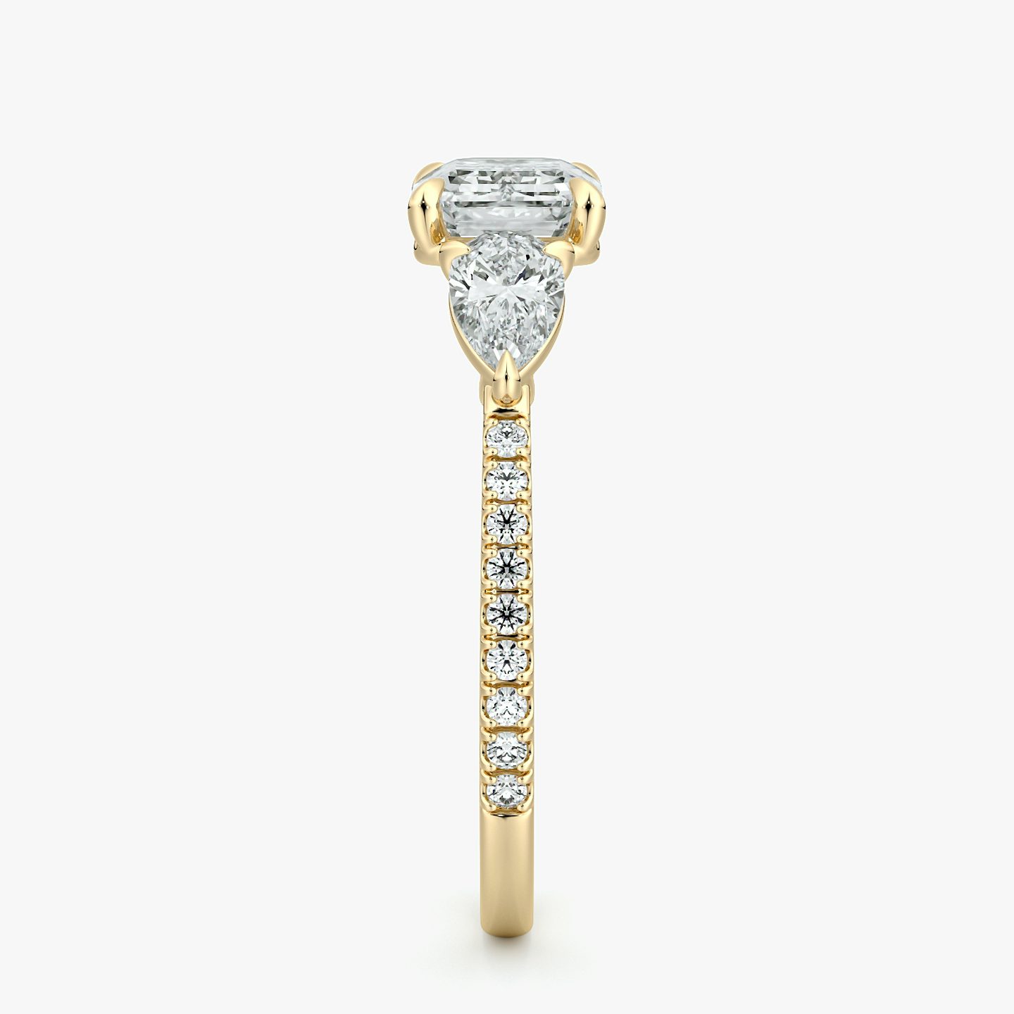 The Three Stone | Emerald | 18k | Yellow Gold | bandAccent: Pavé | diamondOrientation: horizontal | sideStoneCarat: 0.25ct | sideStoneShape: Pear | caratWeight: other