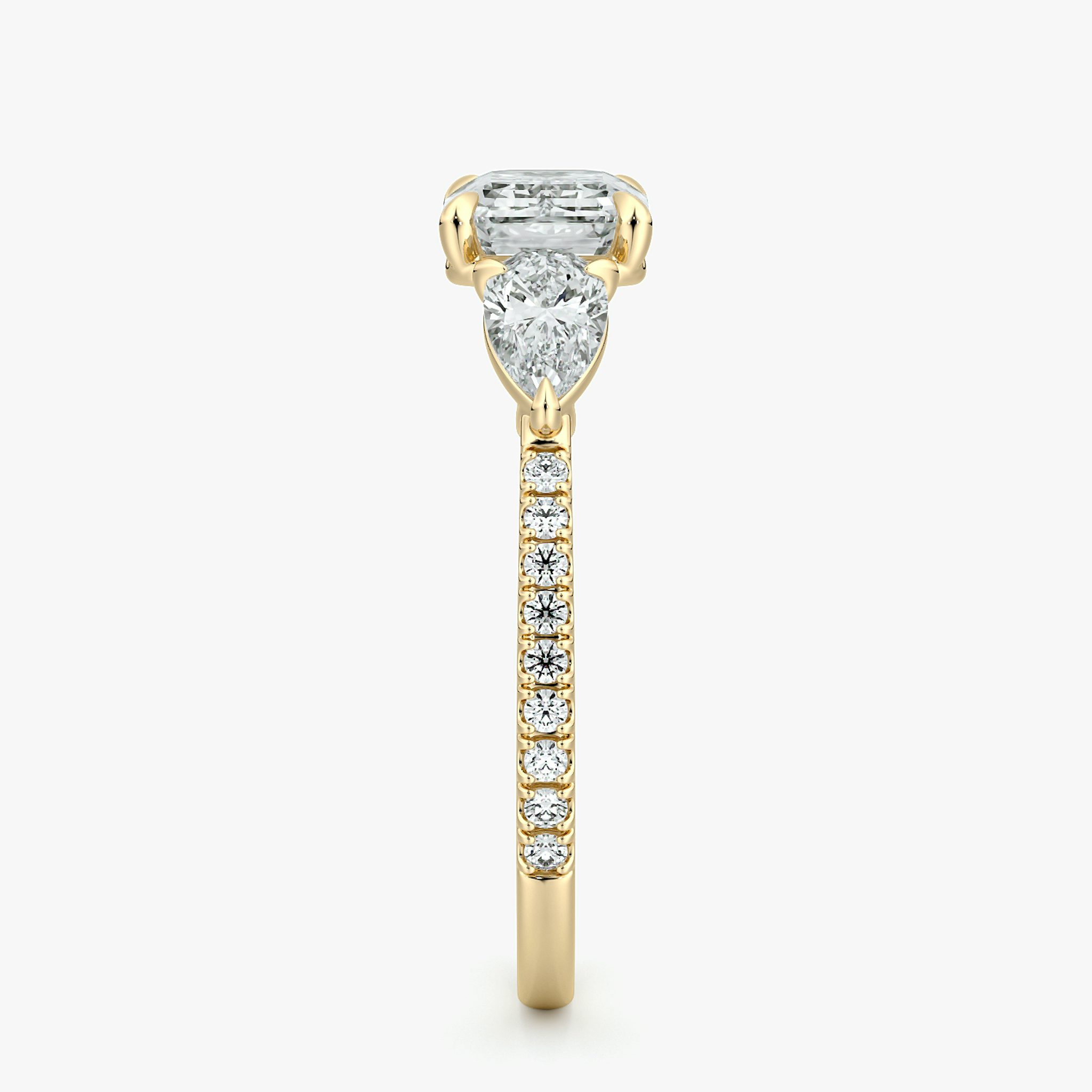 The Three Stone | Emerald | 18k | Yellow Gold | bandAccent: Pavé | diamondOrientation: horizontal | sideStoneCarat: 0.25ct | sideStoneShape: Pear | caratWeight: other