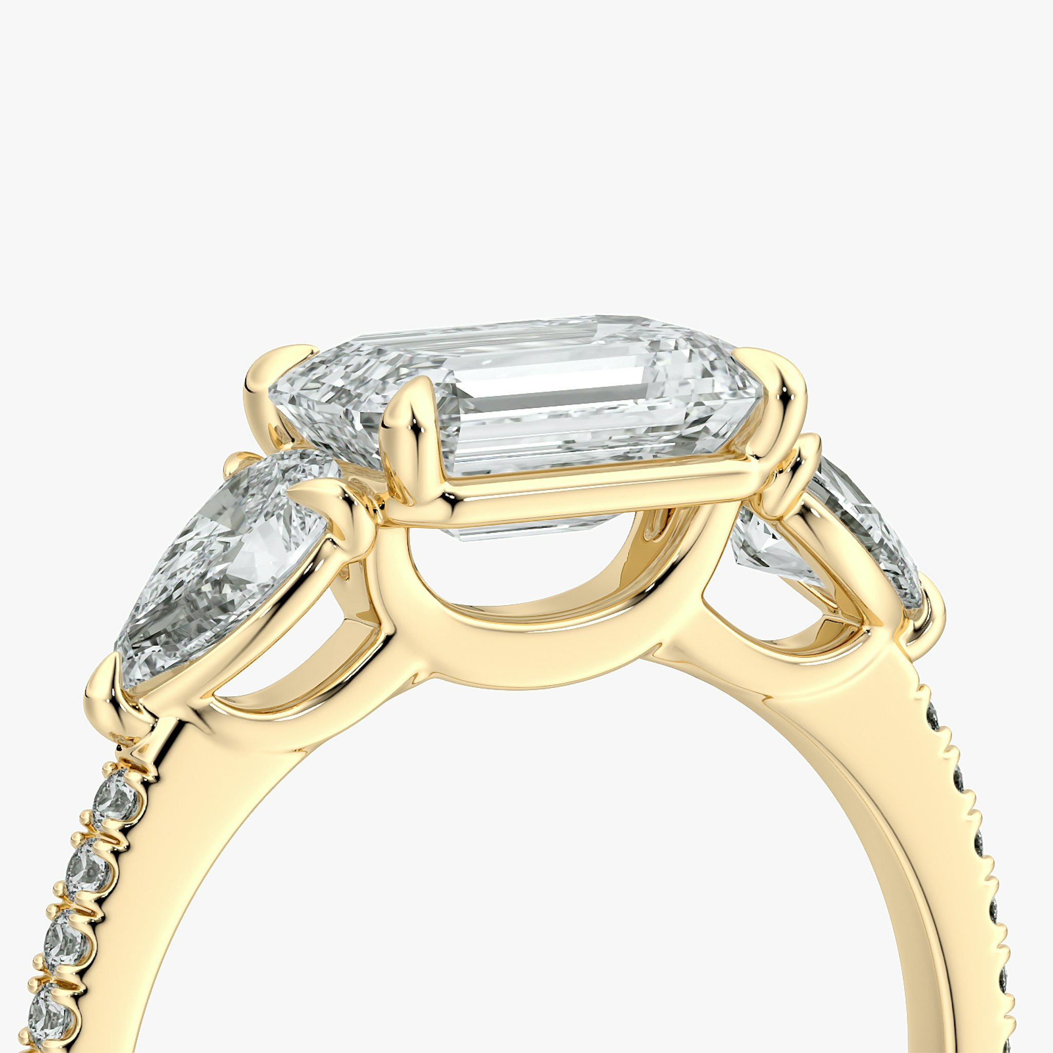 The Three Stone | Emerald | 18k | Yellow Gold | bandAccent: Pavé | diamondOrientation: horizontal | sideStoneCarat: 0.25ct | sideStoneShape: Pear | caratWeight: other