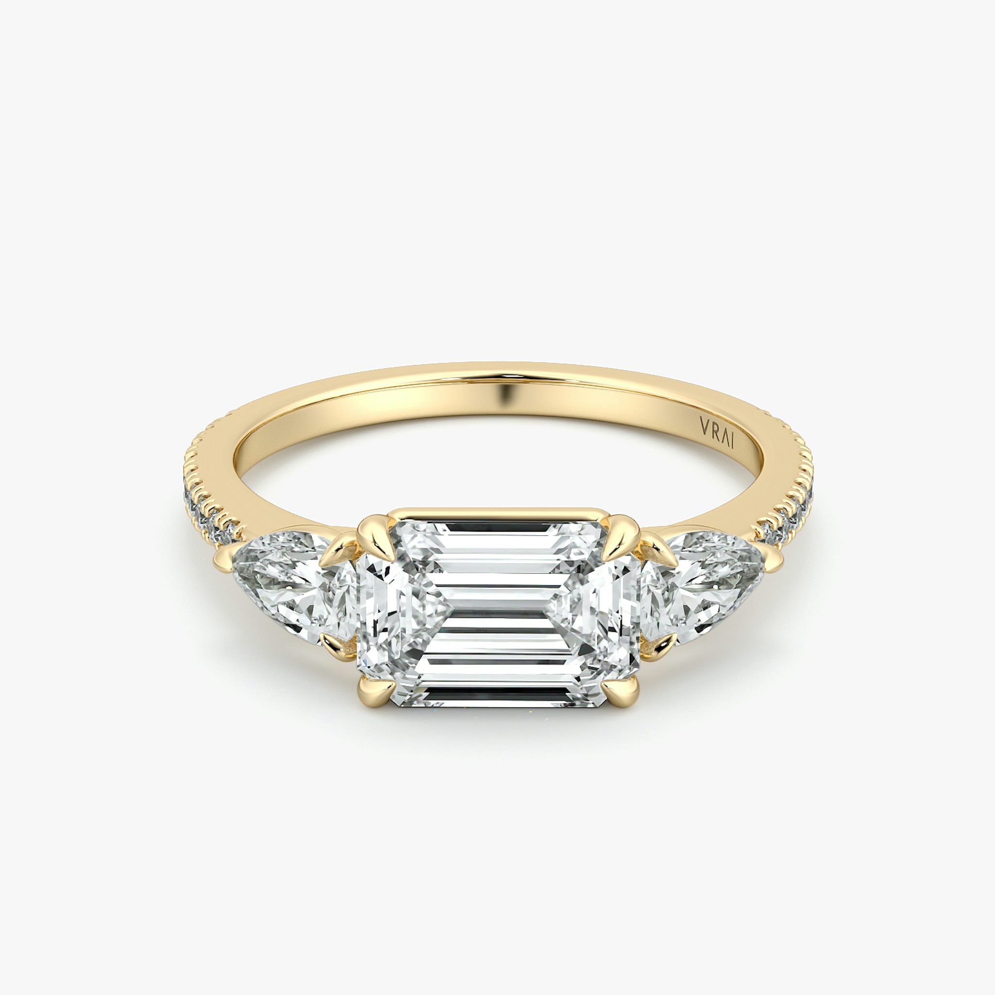 The Three Stone | Emerald | 18k | Yellow Gold | bandAccent: Pavé | diamondOrientation: horizontal | sideStoneCarat: 0.25ct | sideStoneShape: Pear | caratWeight: other