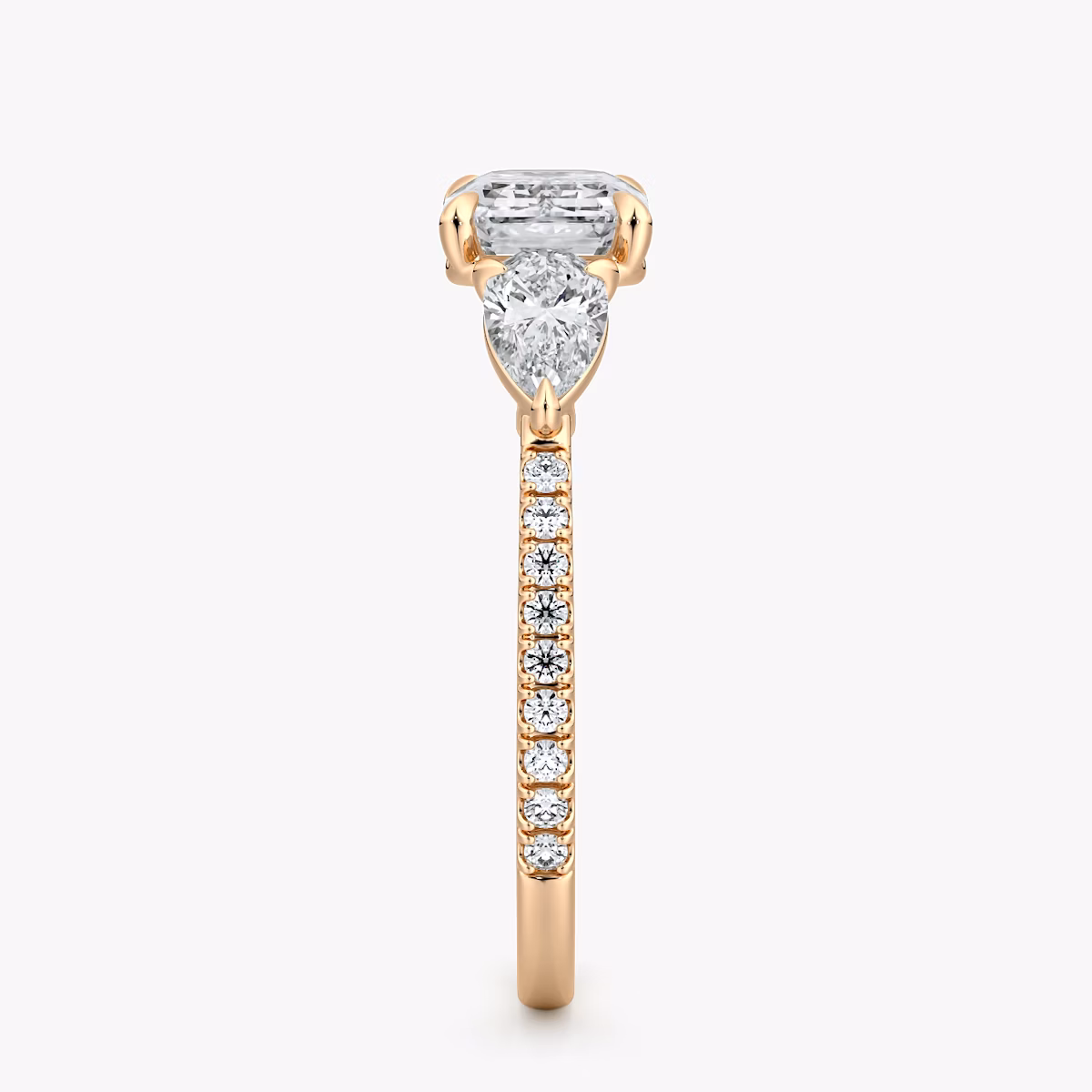 The Three Stone | Emerald | 14k | Rose Gold | bandAccent: Pavé | diamondOrientation: horizontal | sideStoneCarat: 0.25ct | sideStoneShape: Pear | caratWeight: other