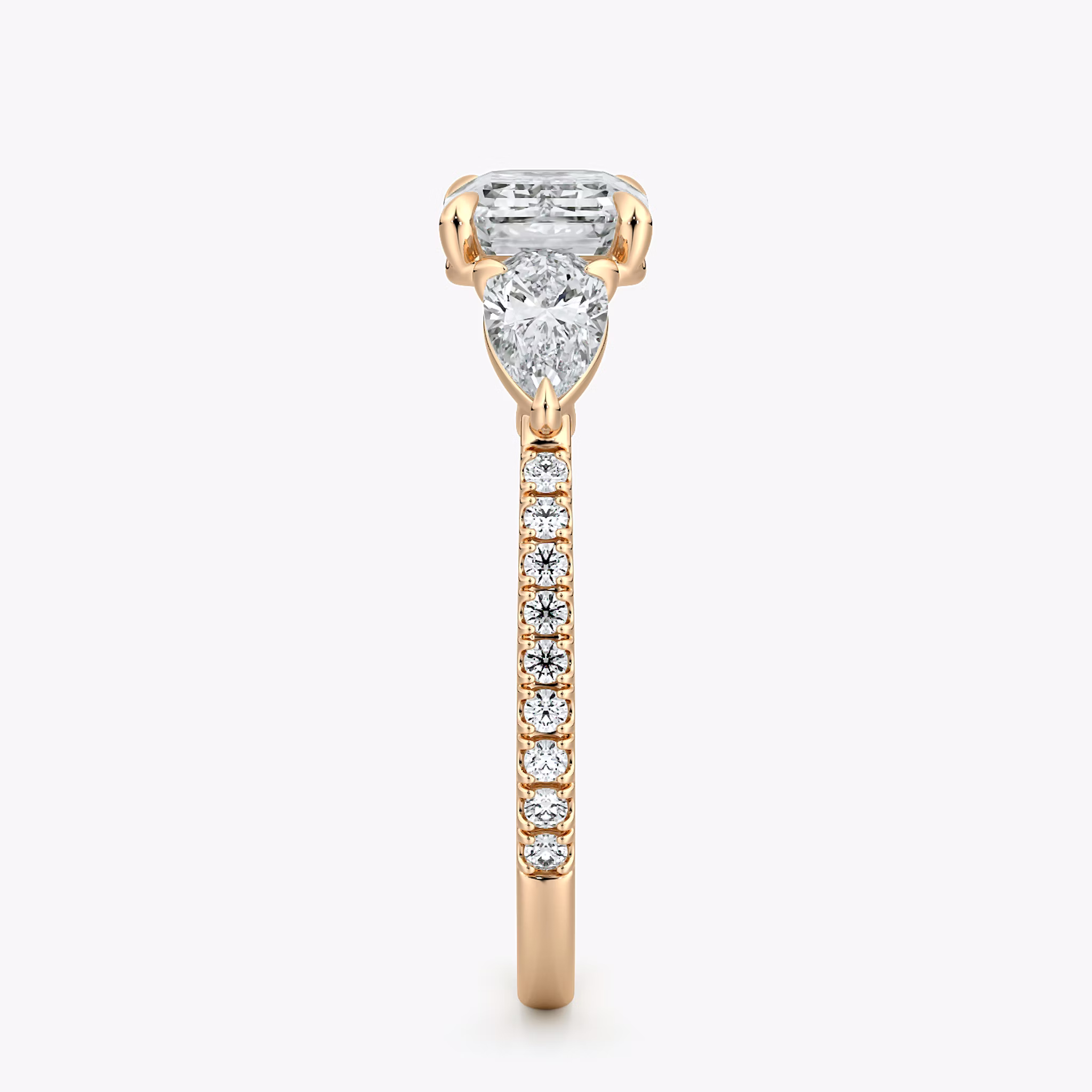 The Three Stone | Emerald | 14k | Rose Gold | bandAccent: Pavé | diamondOrientation: horizontal | sideStoneCarat: 0.25ct | sideStoneShape: Pear | caratWeight: other